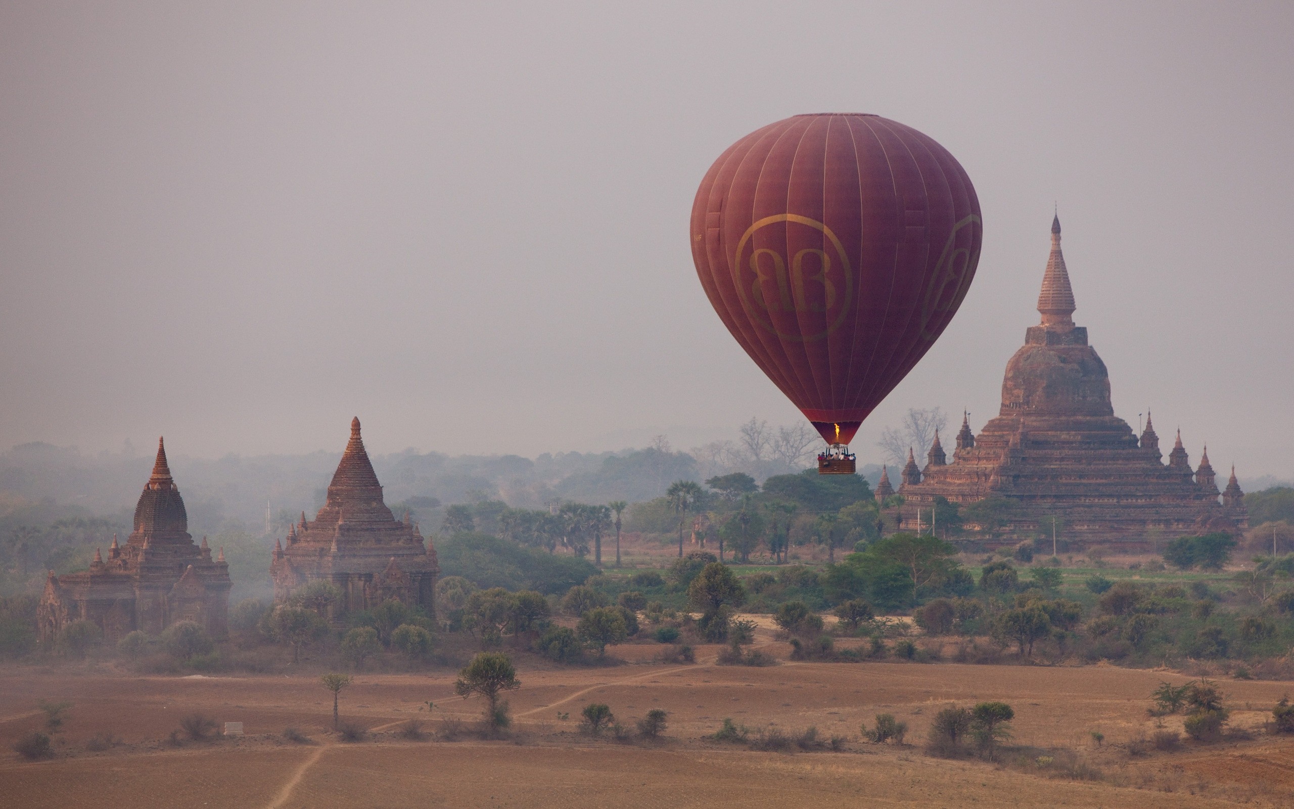 Hot air balloon over ancient temples in Bagan, Myanmar HD Wallpaper