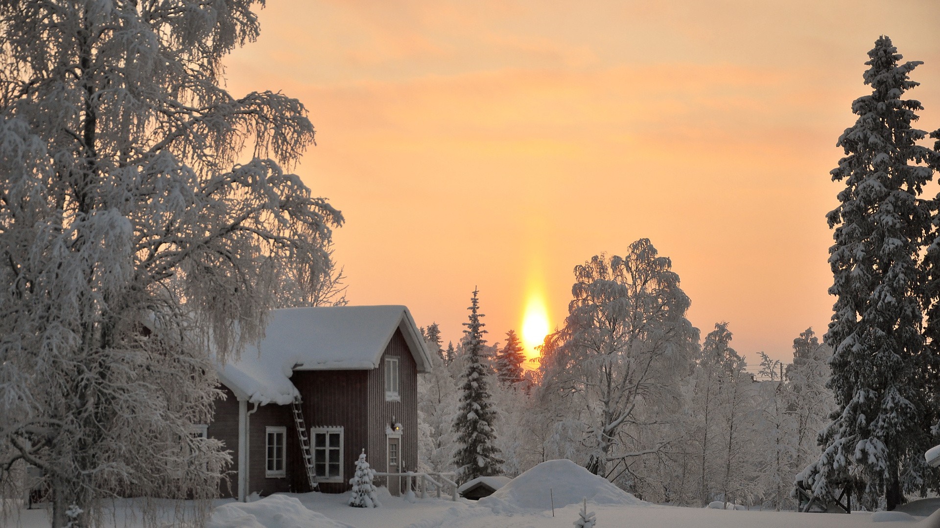 Winter sunset over a snowy landscape with a house HD Wallpaper