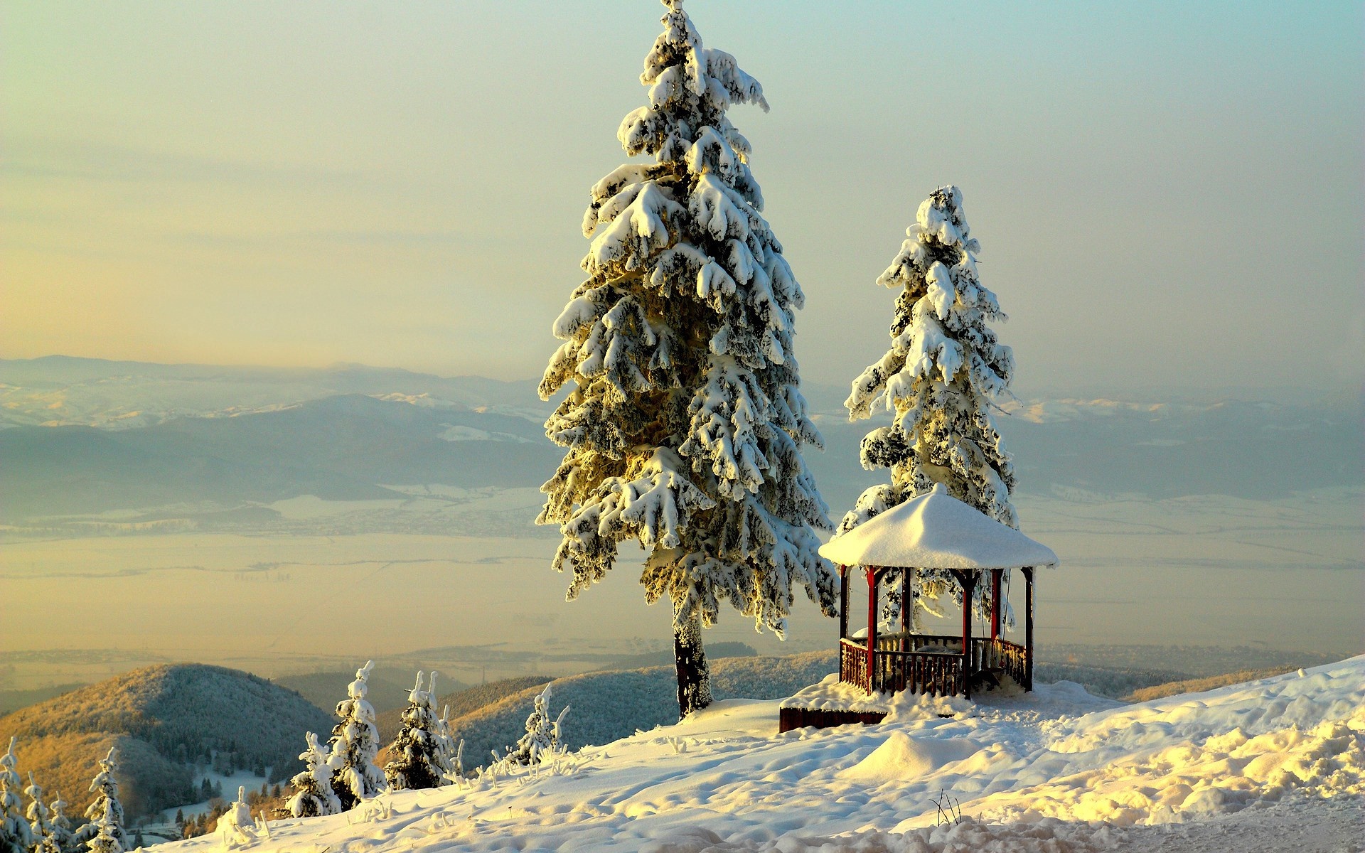 Snowy trees and gazebo on a mountain overlooking a valley HD Wallpaper
