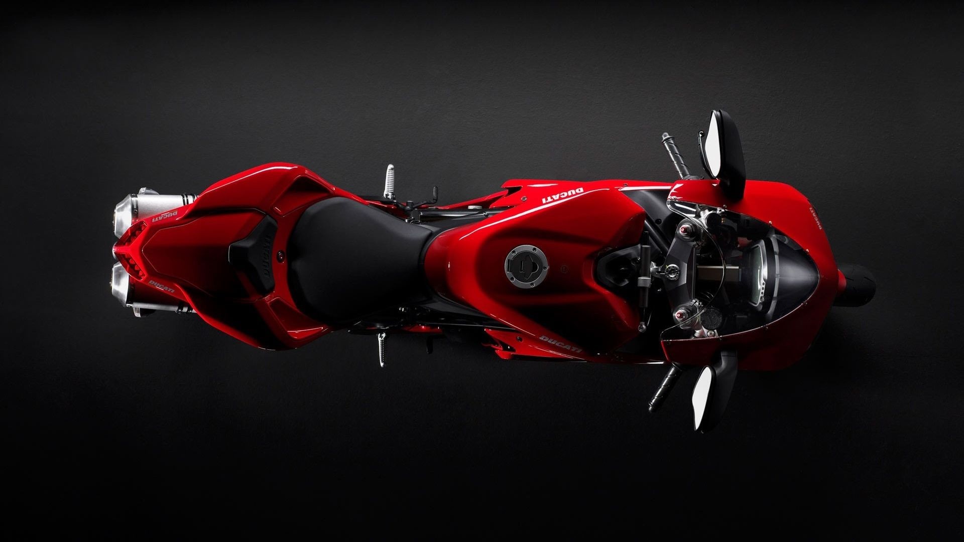 Red Ducati motorcycle from a top-down view HD Wallpaper