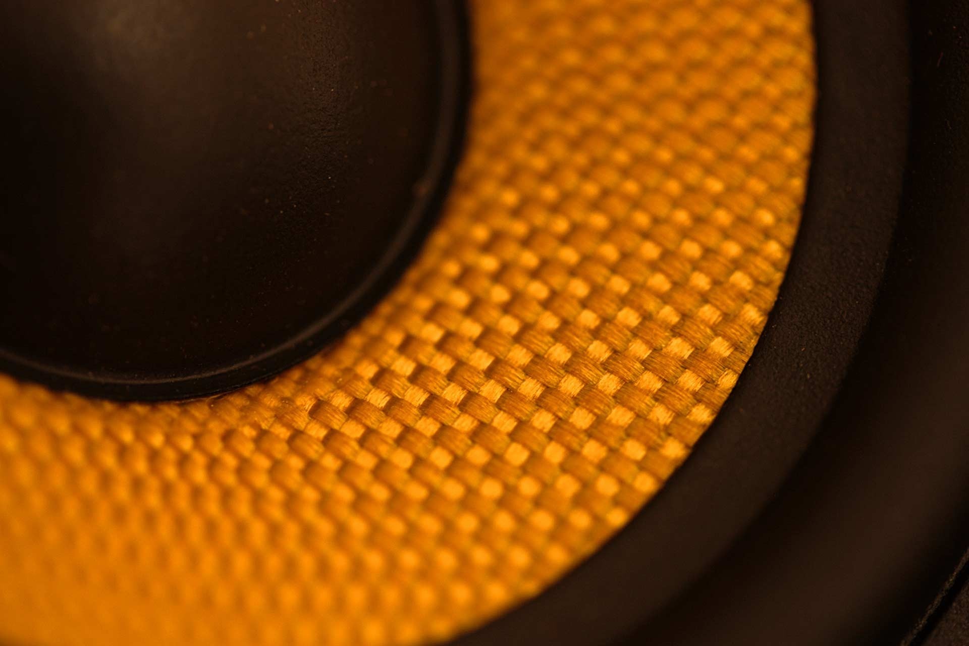 Close-up of a yellow speaker cone with black surround HD Wallpaper