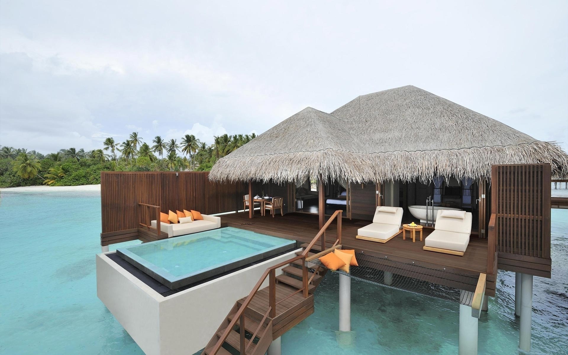 Overwater villa with private pool and lounge area HD Wallpaper