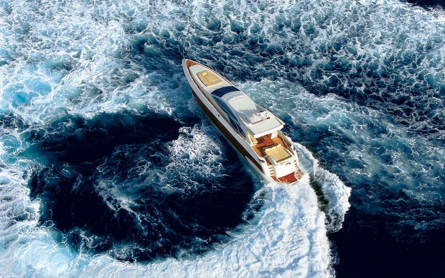Luxury yacht sailing through choppy blue water HD Wallpaper