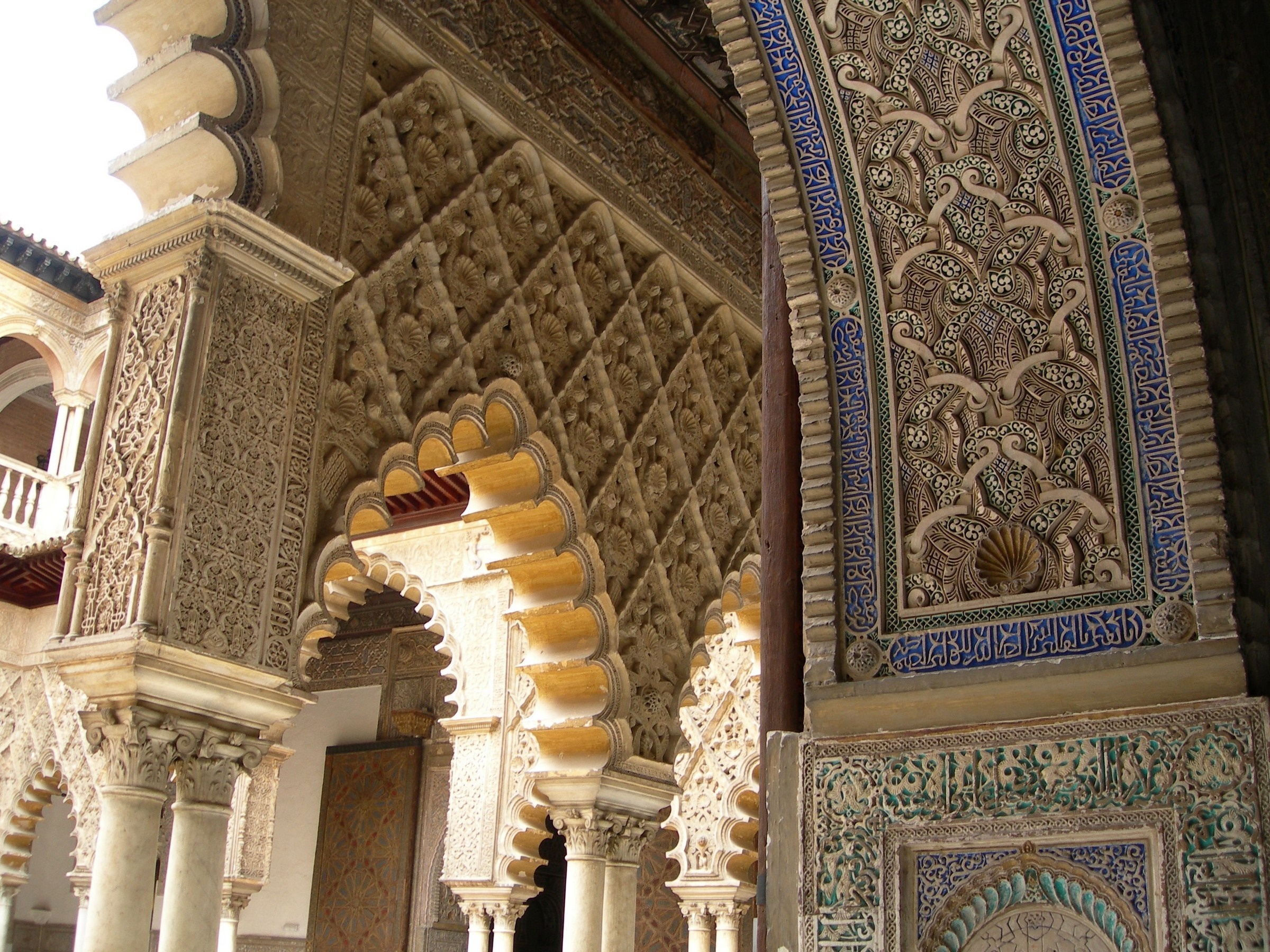 Intricate Islamic Architecture with Arches and Carvings HD Wallpaper