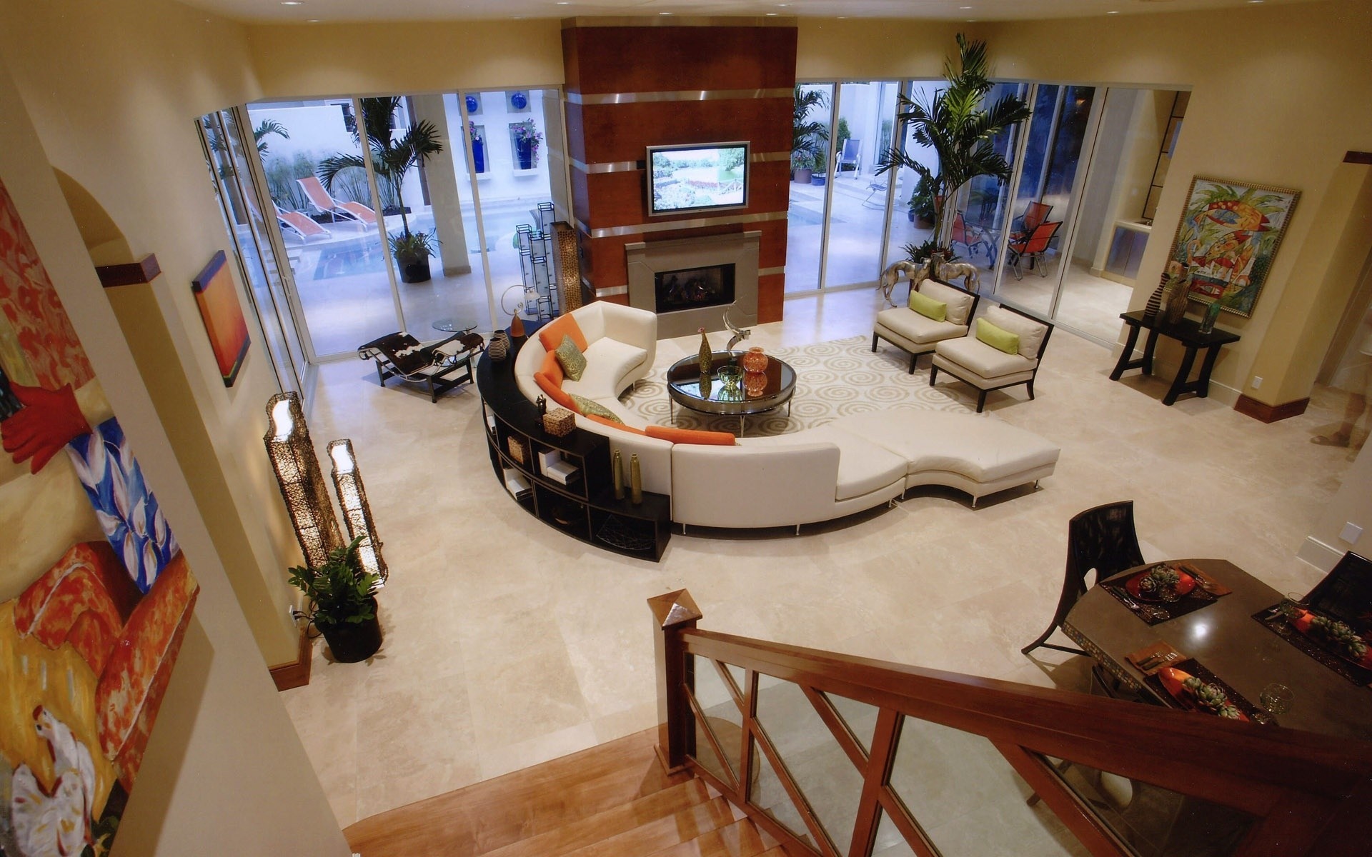 Modern living room with curved sofa and fireplace HD Wallpaper
