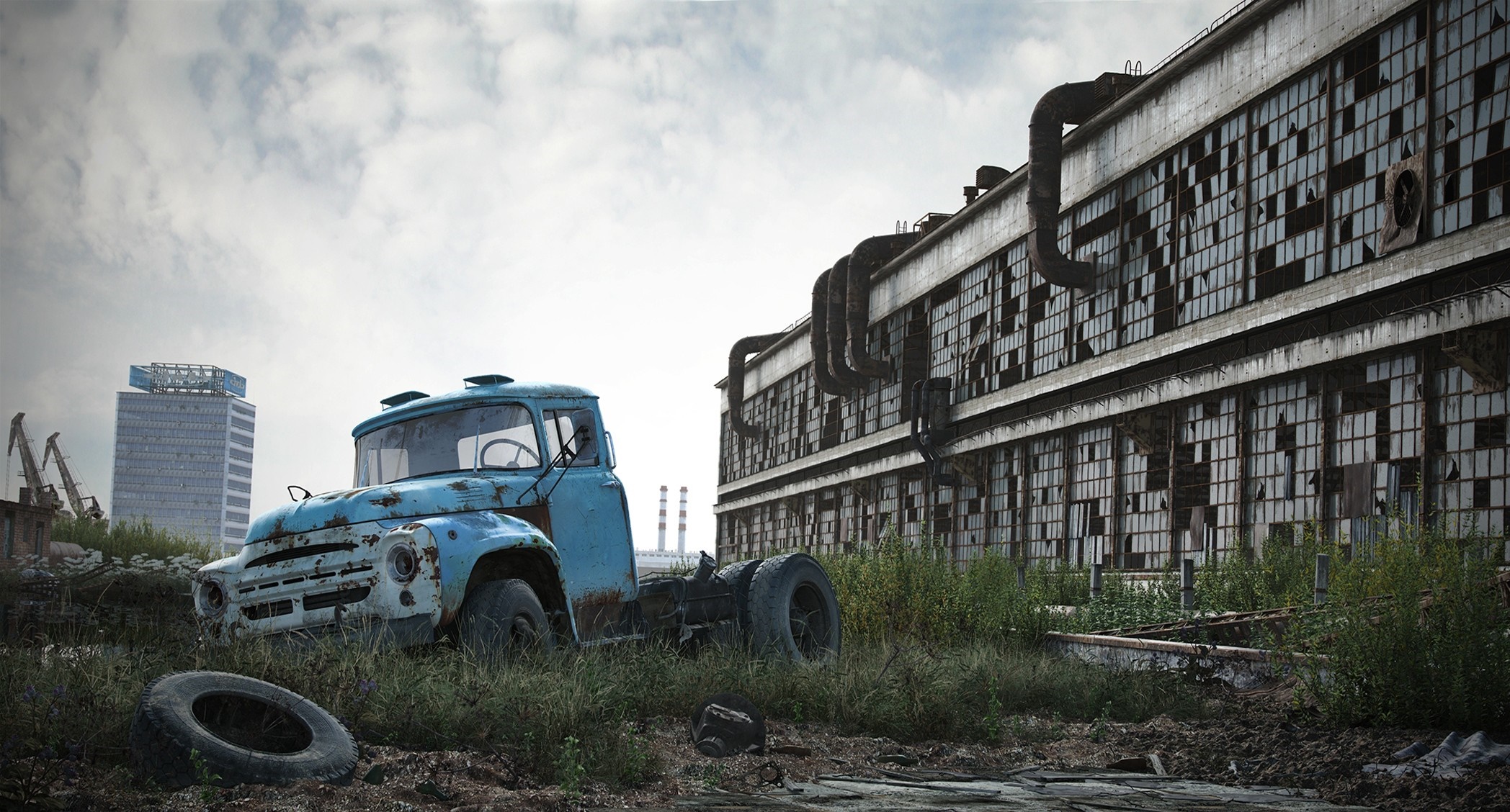 Abandoned truck and factory in overgrown industrial area HD Wallpaper