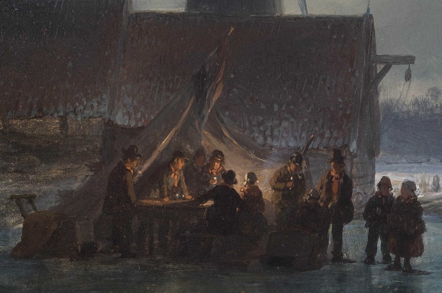 People gathered around a table under a tent in winter HD Wallpaper