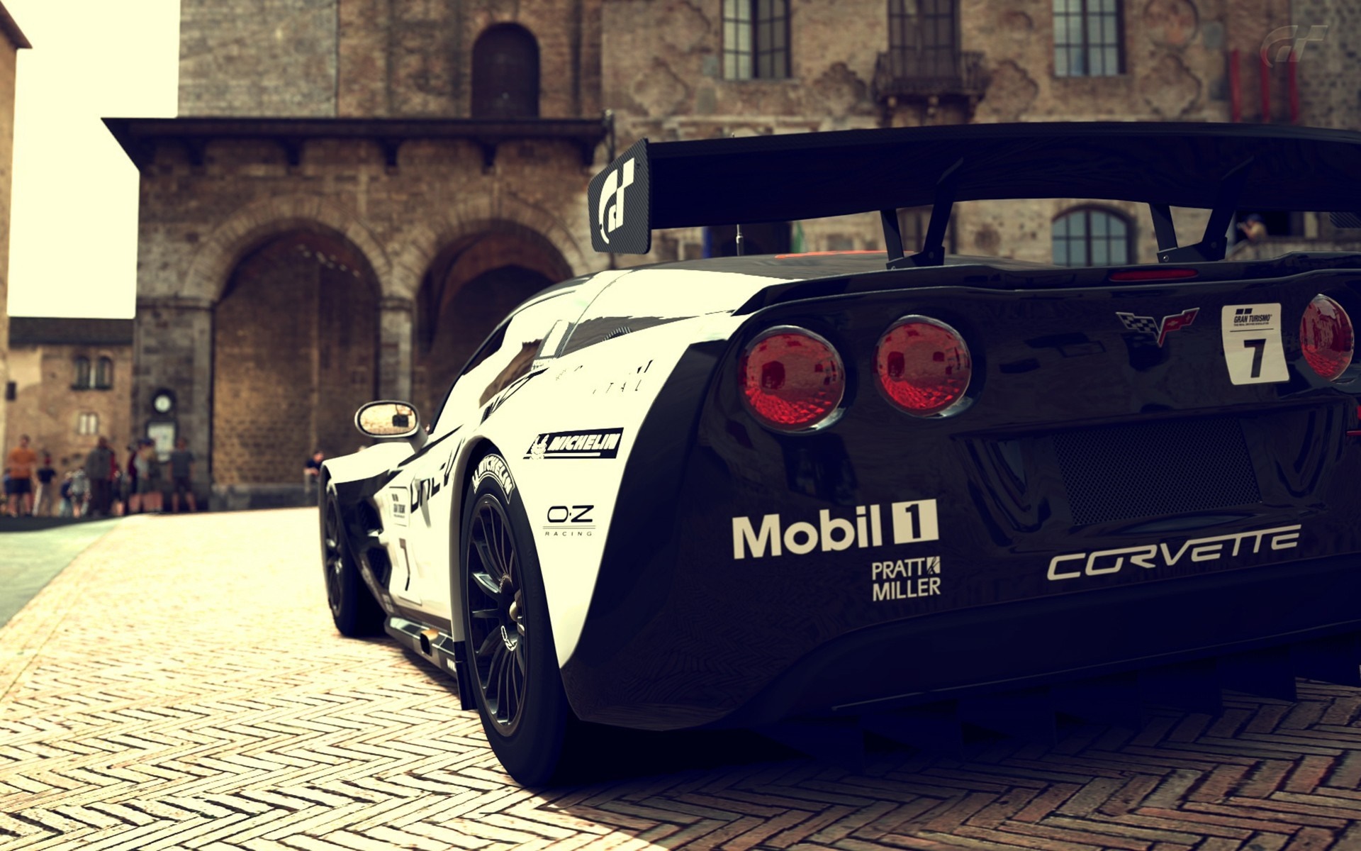 Corvette C6.R GT3 race car on cobblestone street HD Wallpaper