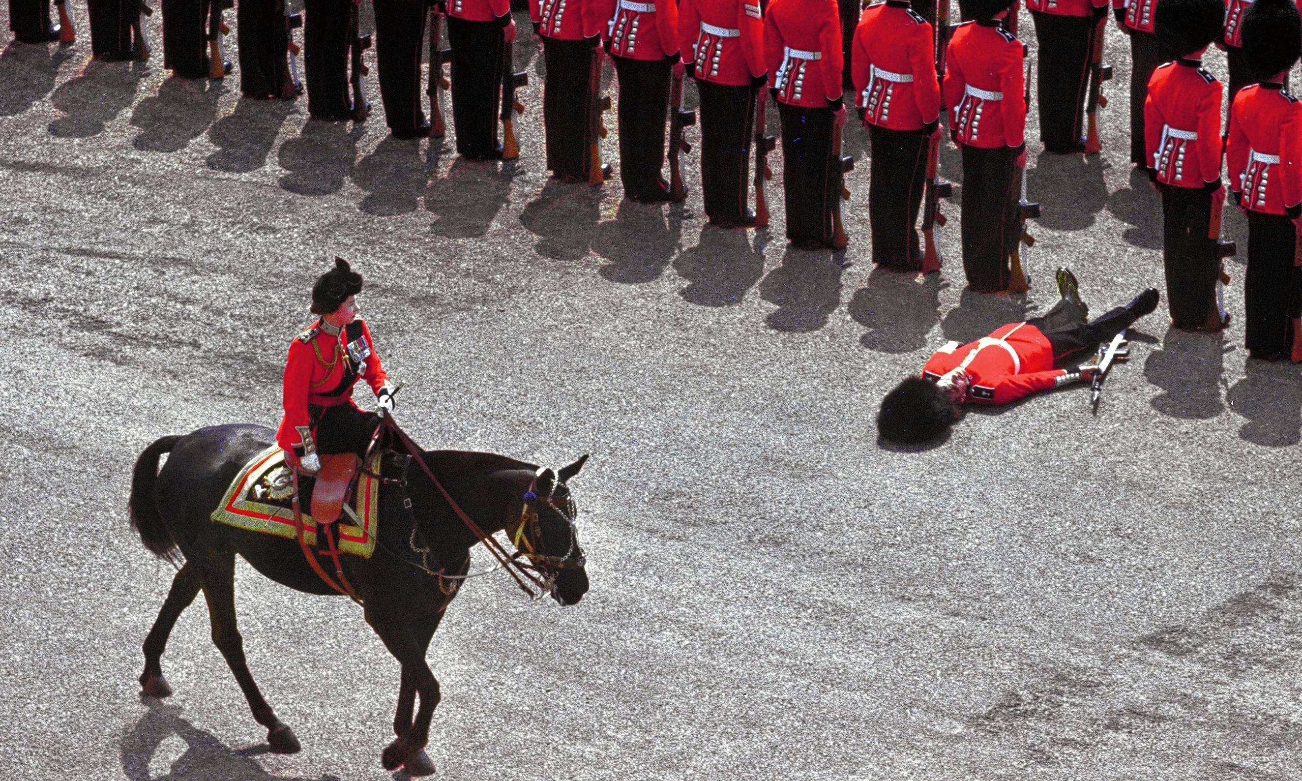 Soldier collapses during a ceremonial parade in England HD Wallpaper