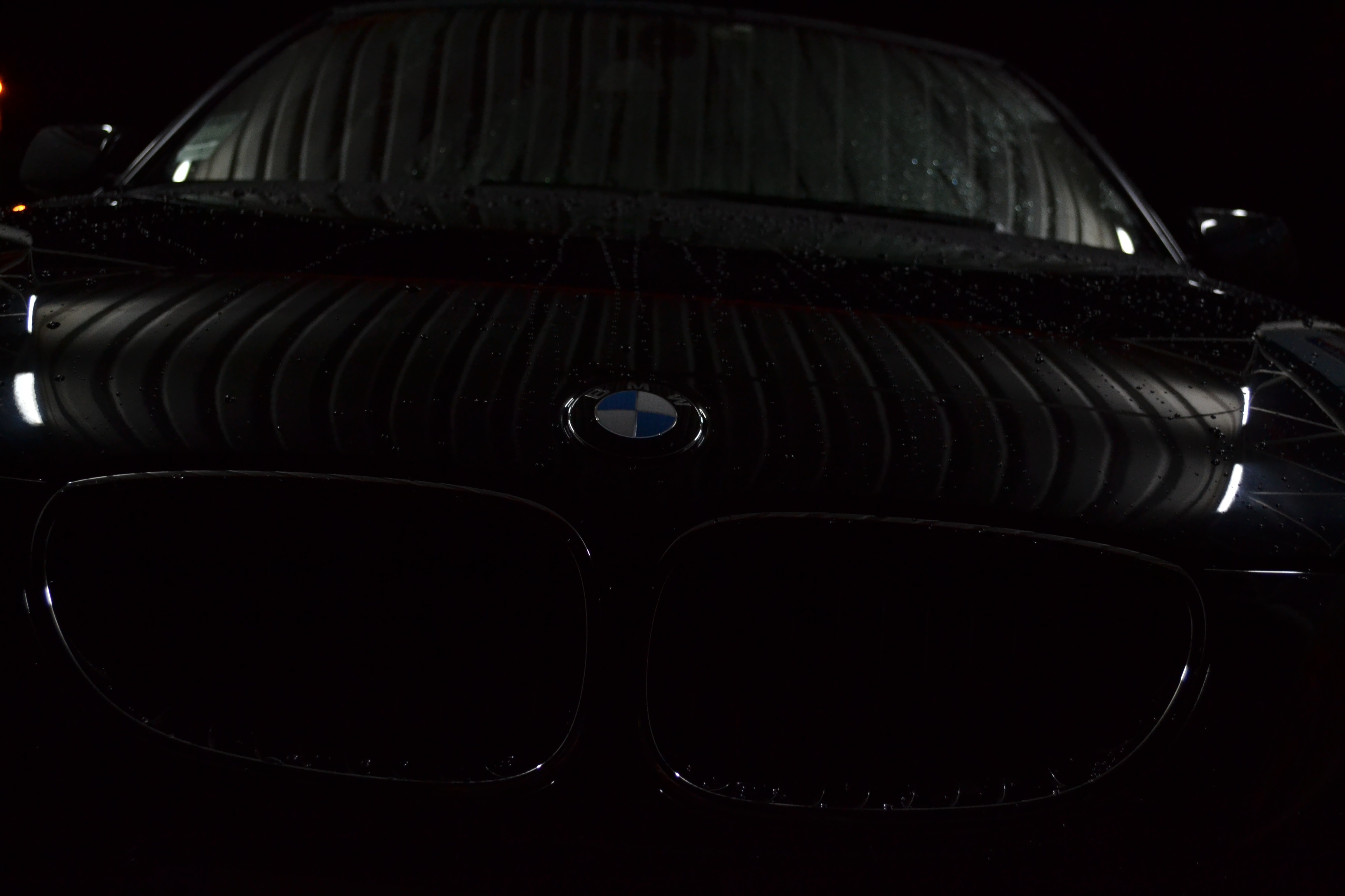 Black BMW car with water droplets HD Wallpaper