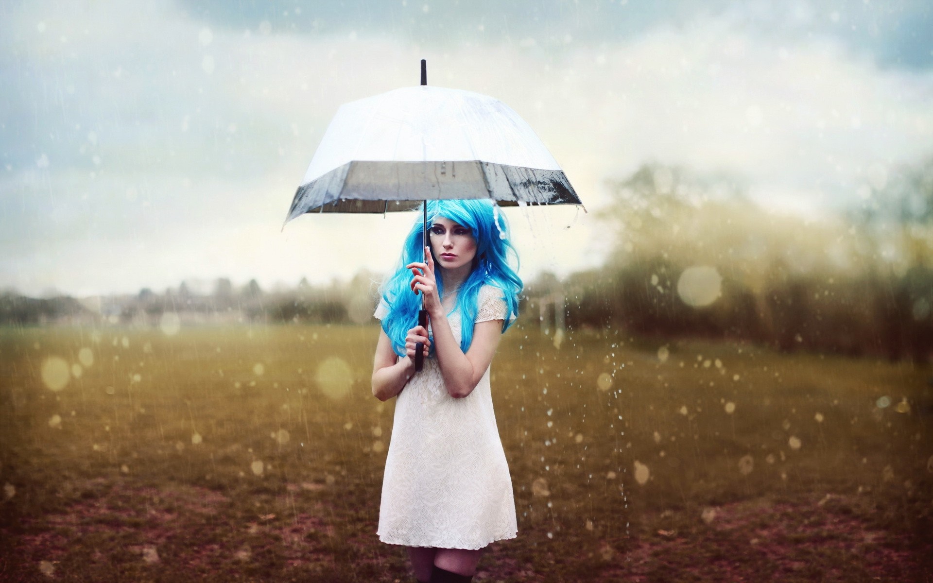 Woman with blue hair holding an umbrella in the rain HD Wallpaper