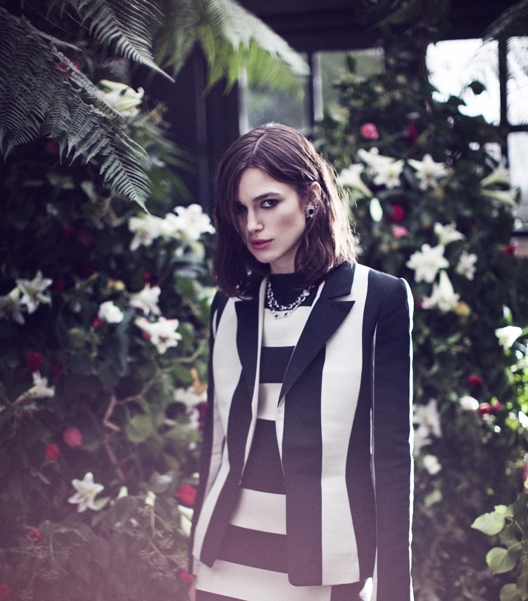 Keira Knightley in a black and white striped suit HD Wallpaper