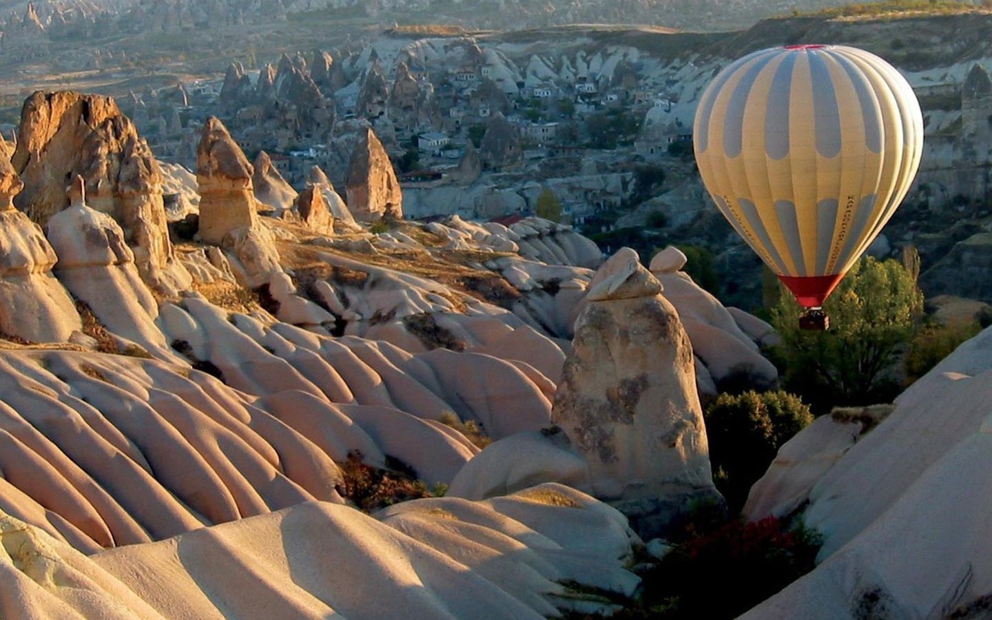 Hot air balloon over Cappadocia rock formations HD Wallpaper