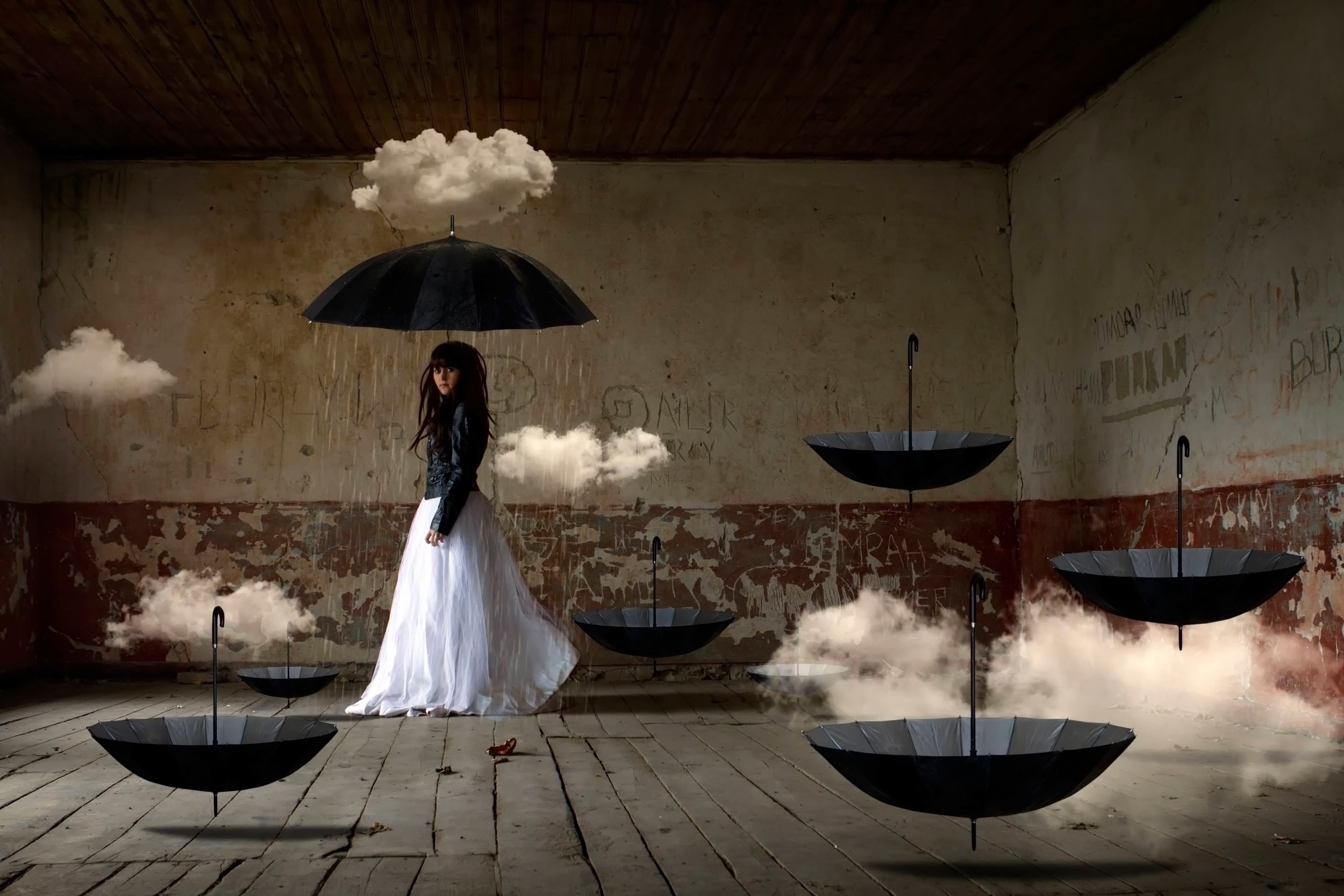 Woman in white dress under umbrella with floating clouds and umbrellas HD Wallpaper