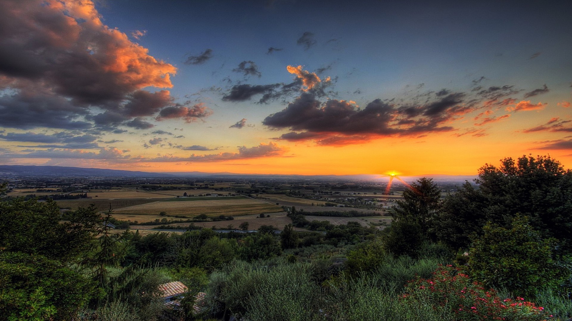 Sunset over a rural landscape with clouds HD Wallpaper