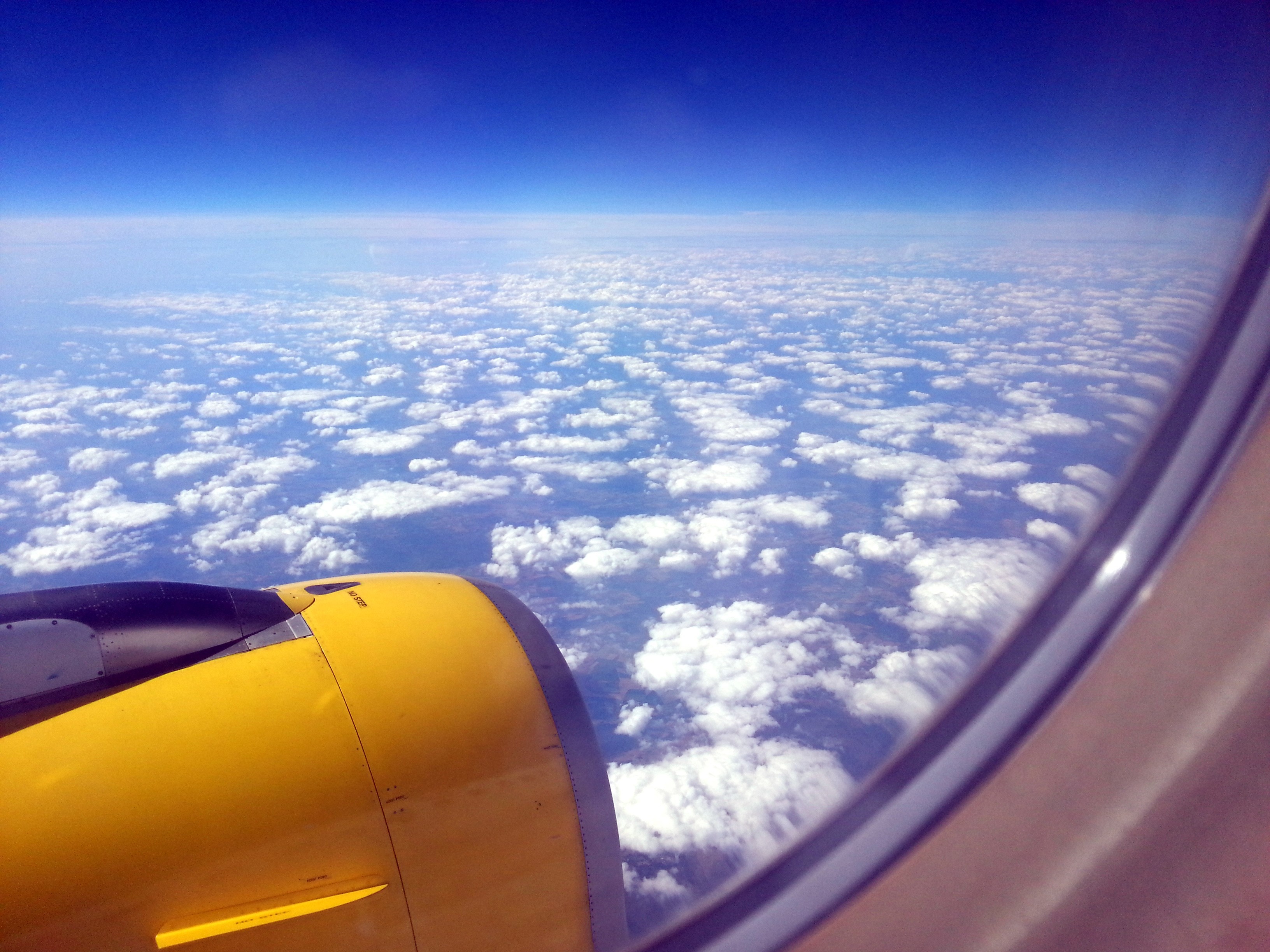 Airplane engine flying over clouds HD Wallpaper