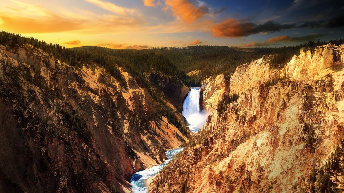 Waterfall in a canyon at sunset HD Wallpaper