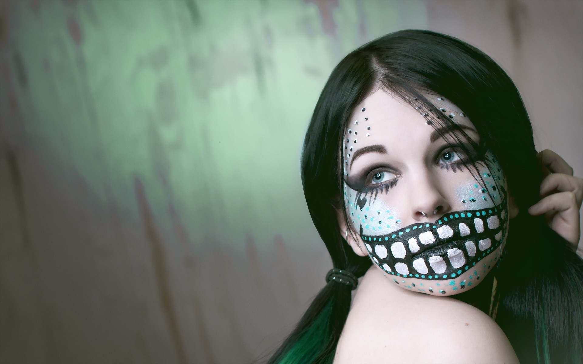 Woman with creative face paint and dark hair HD Wallpaper