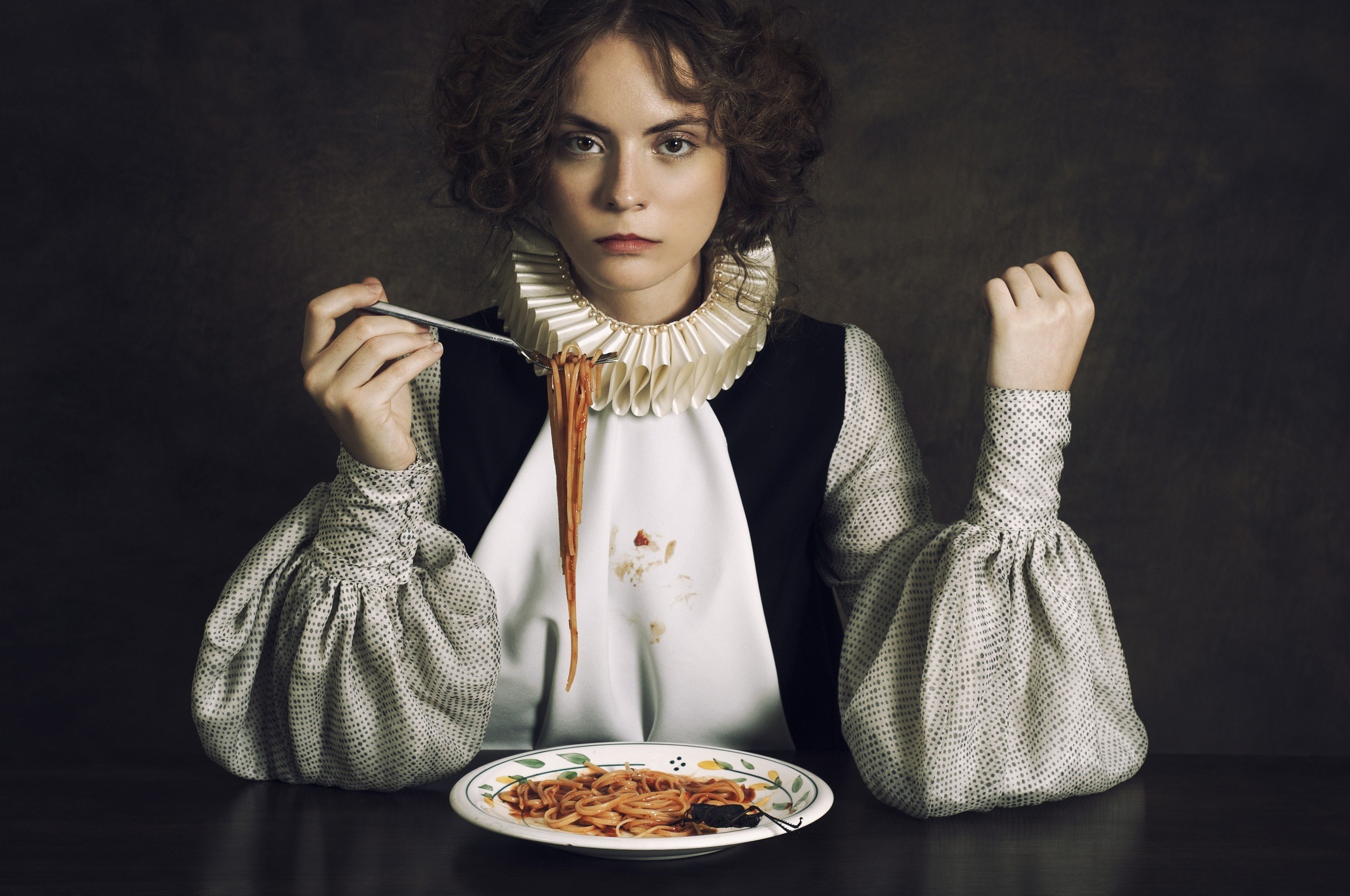 Woman in historical dress eating spaghetti HD Wallpaper