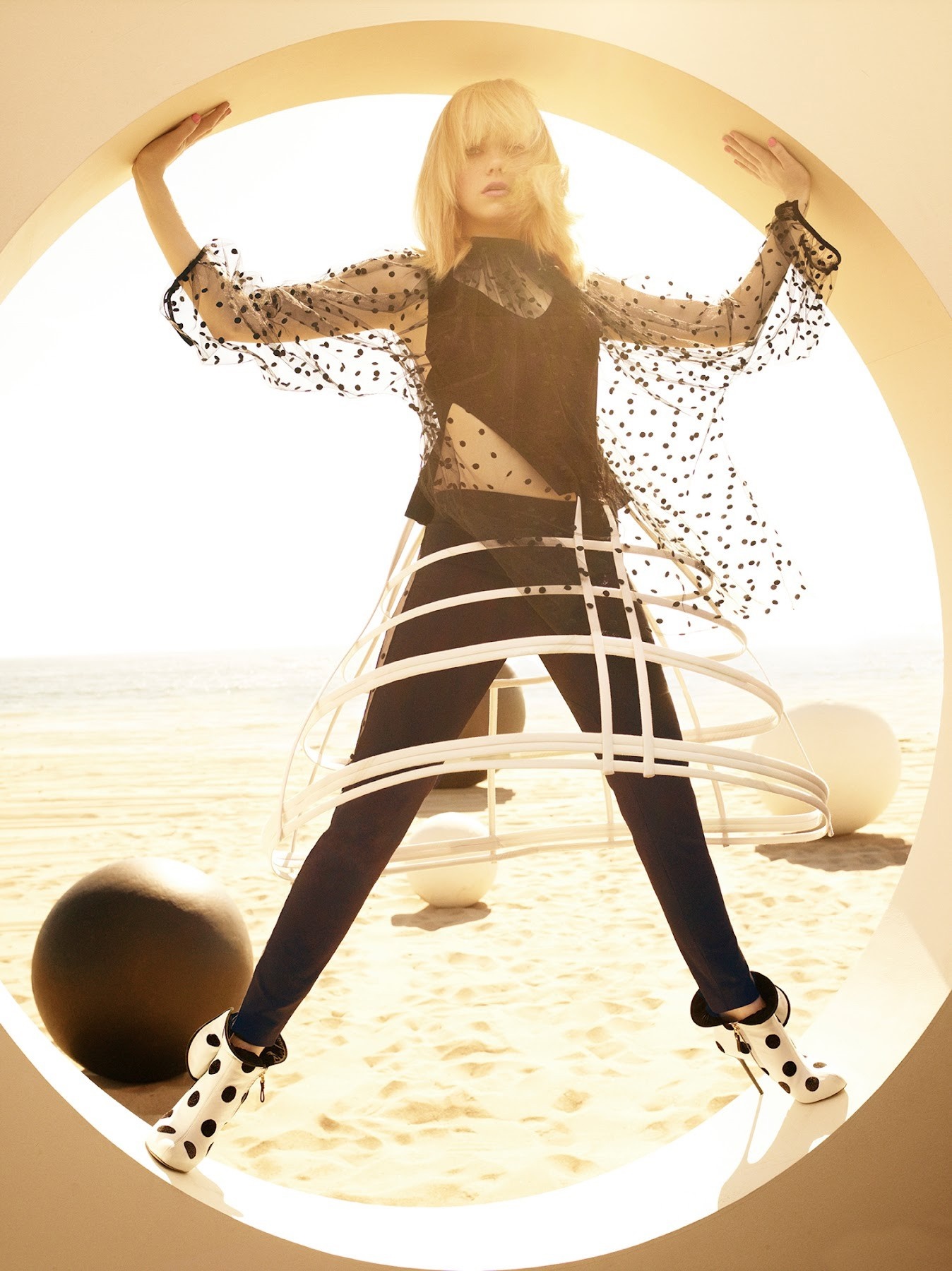 Emma Stone on a beach with abstract sculptures HD Wallpaper
