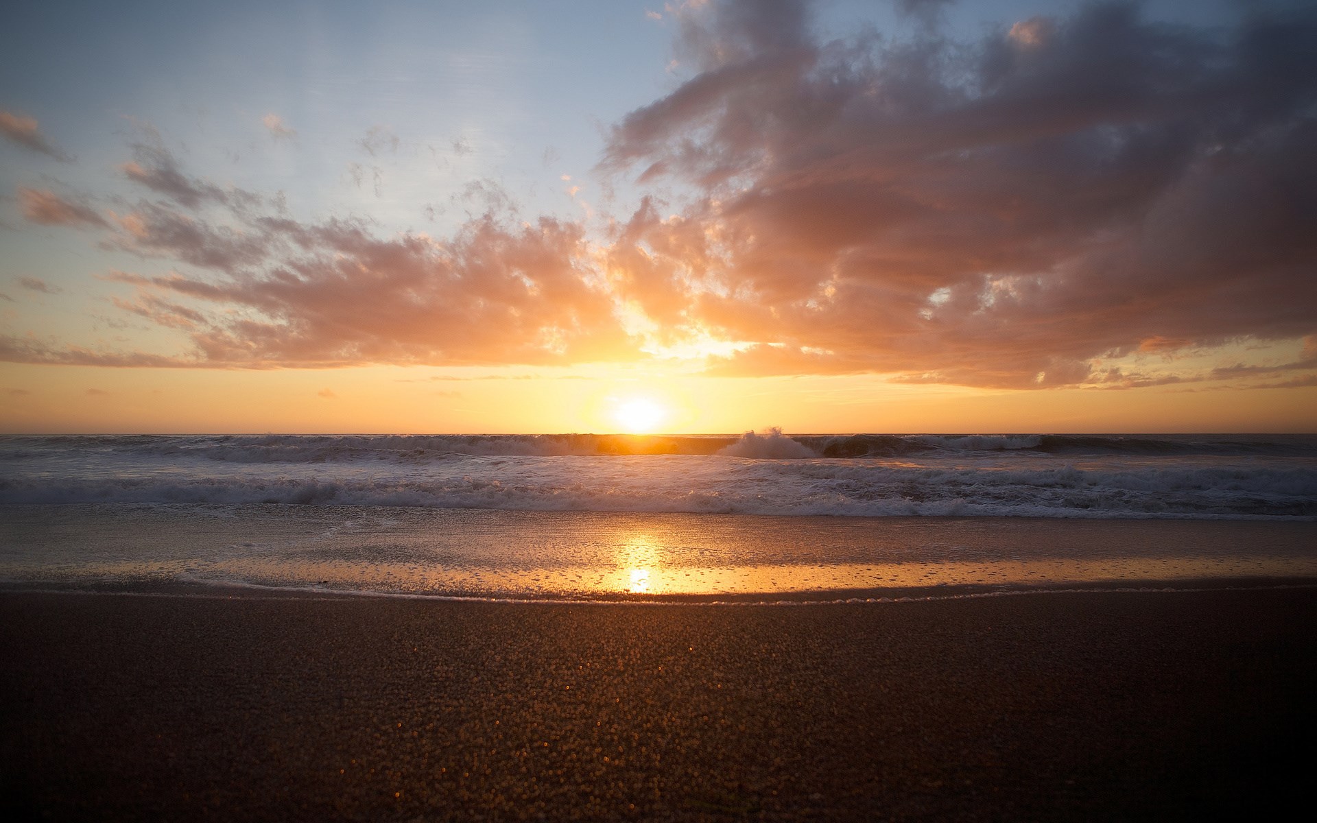 Sunset over the ocean with waves and clouds HD Wallpaper