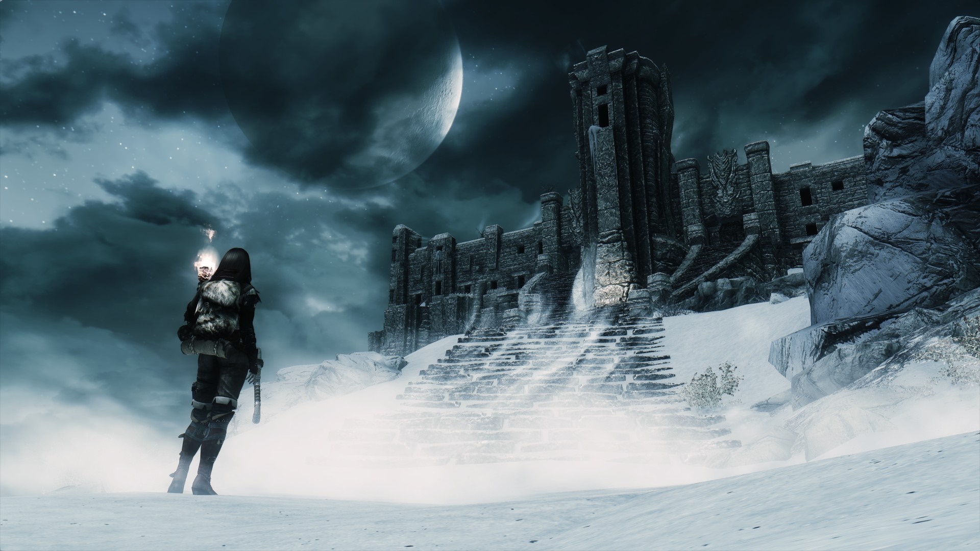Character with torch in snowy ruins from The Elder Scrolls V Skyrim HD Wallpaper
