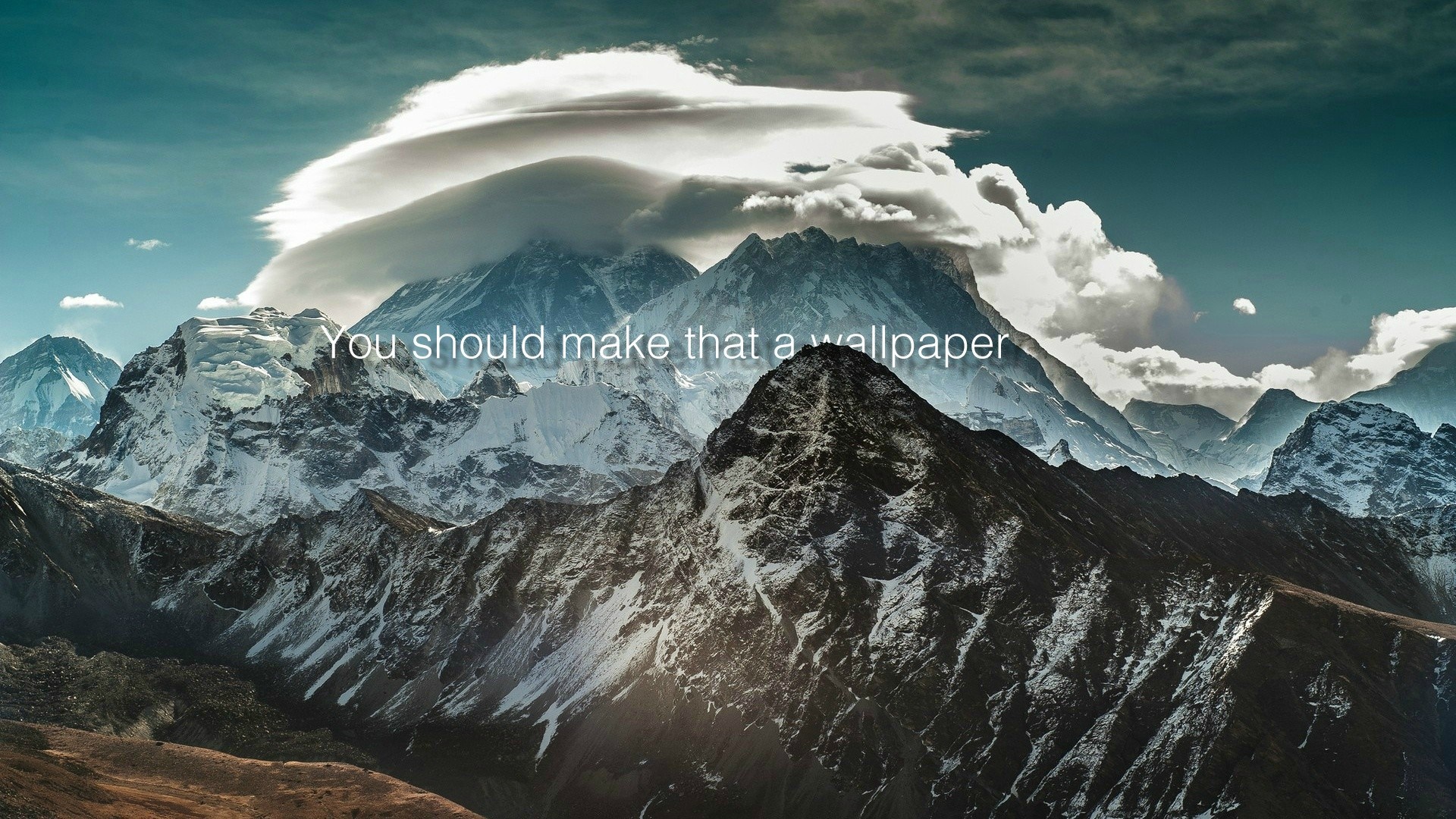 Mountains with clouds and text HD Wallpaper