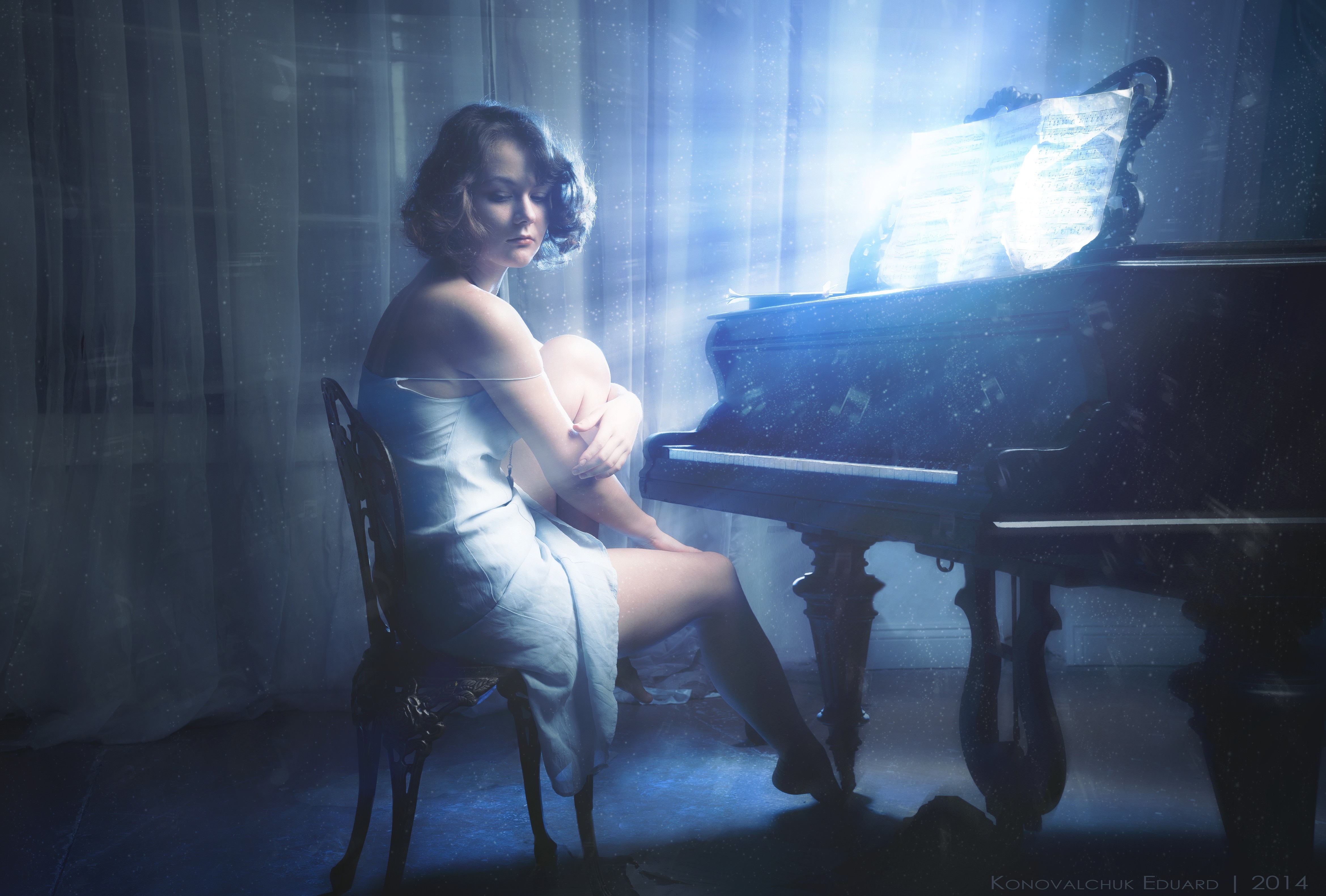 Woman sitting by a piano with sheet music HD Wallpaper