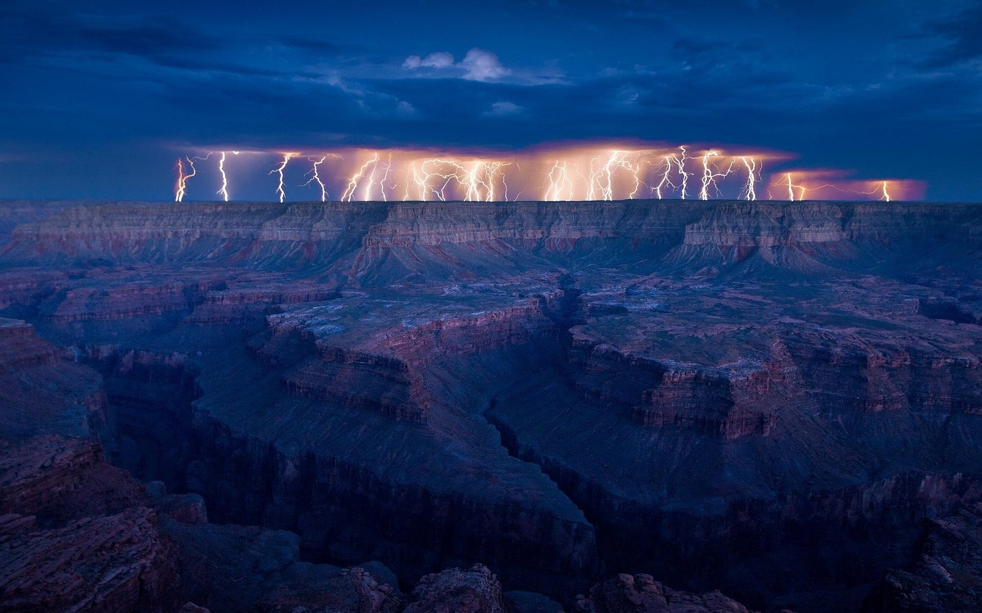 Lightning strikes over the Grand Canyon at dusk HD Wallpaper