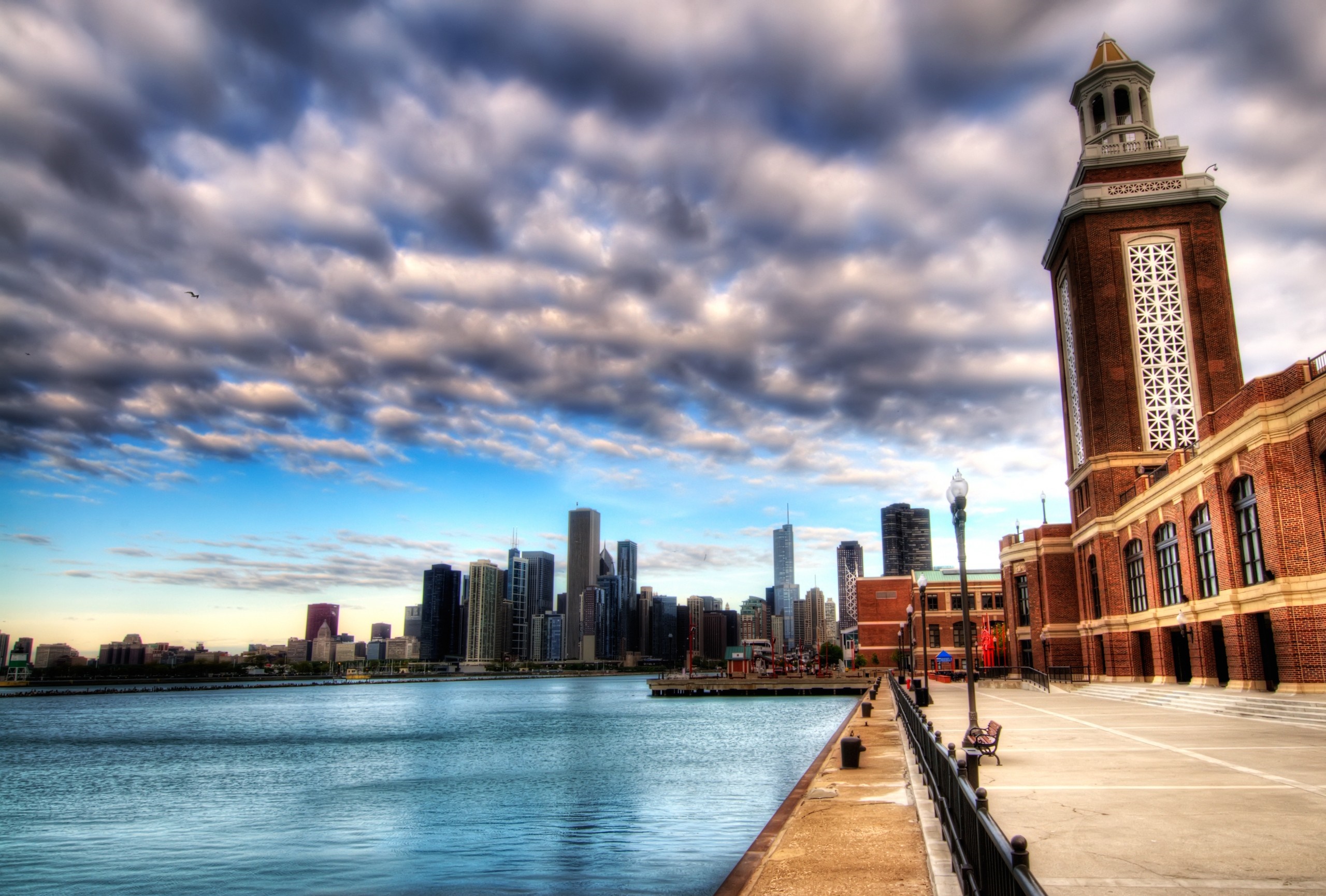 Chicago skyline with a brick tower by the water HD Wallpaper