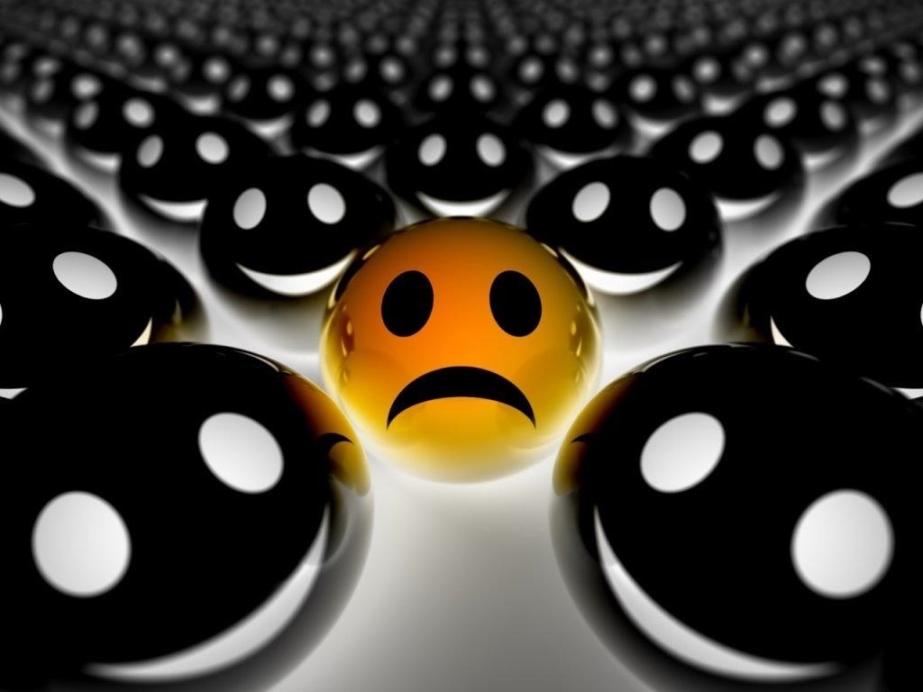 Sad orange ball among happy black balls HD Wallpaper