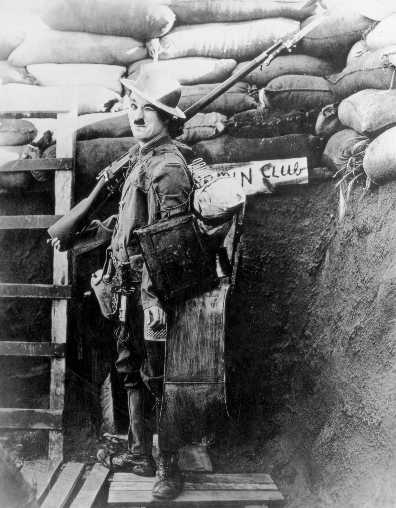 Charlie Chaplin as a soldier in a trench HD Wallpaper
