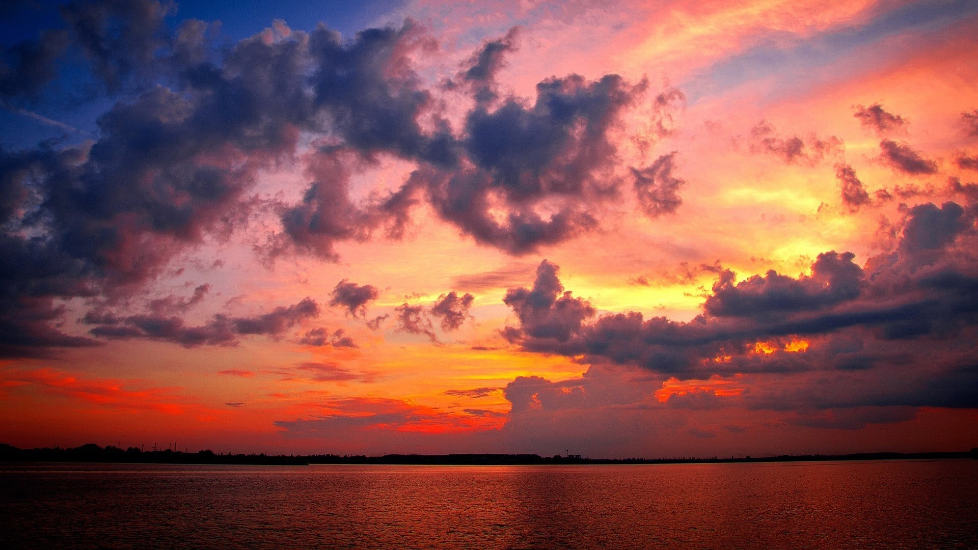 Dramatic Sunset Over Water with Clouds HD Wallpaper