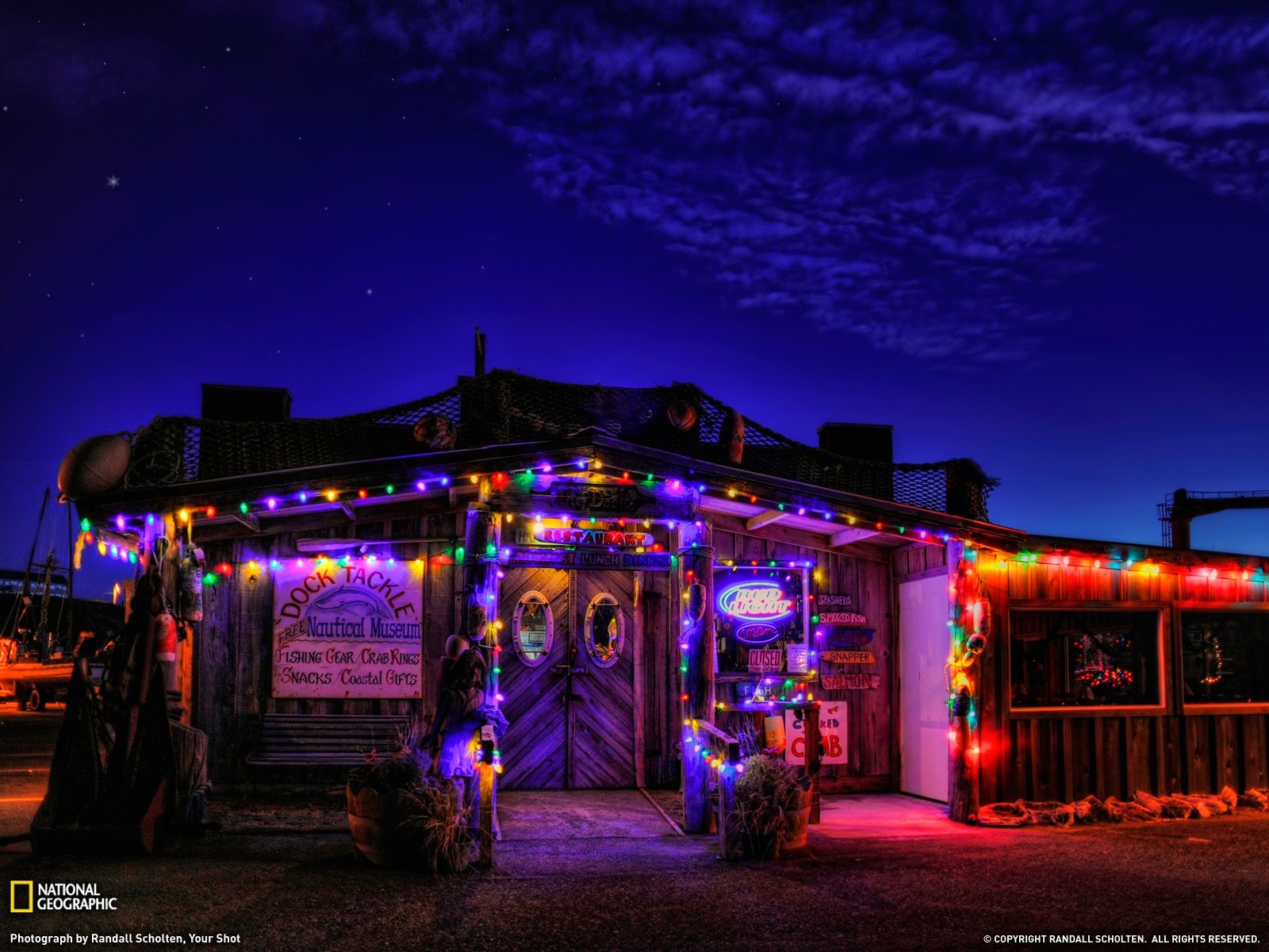 Dock Tackle Nautical Museum decorated with Christmas lights at night HD Wallpaper
