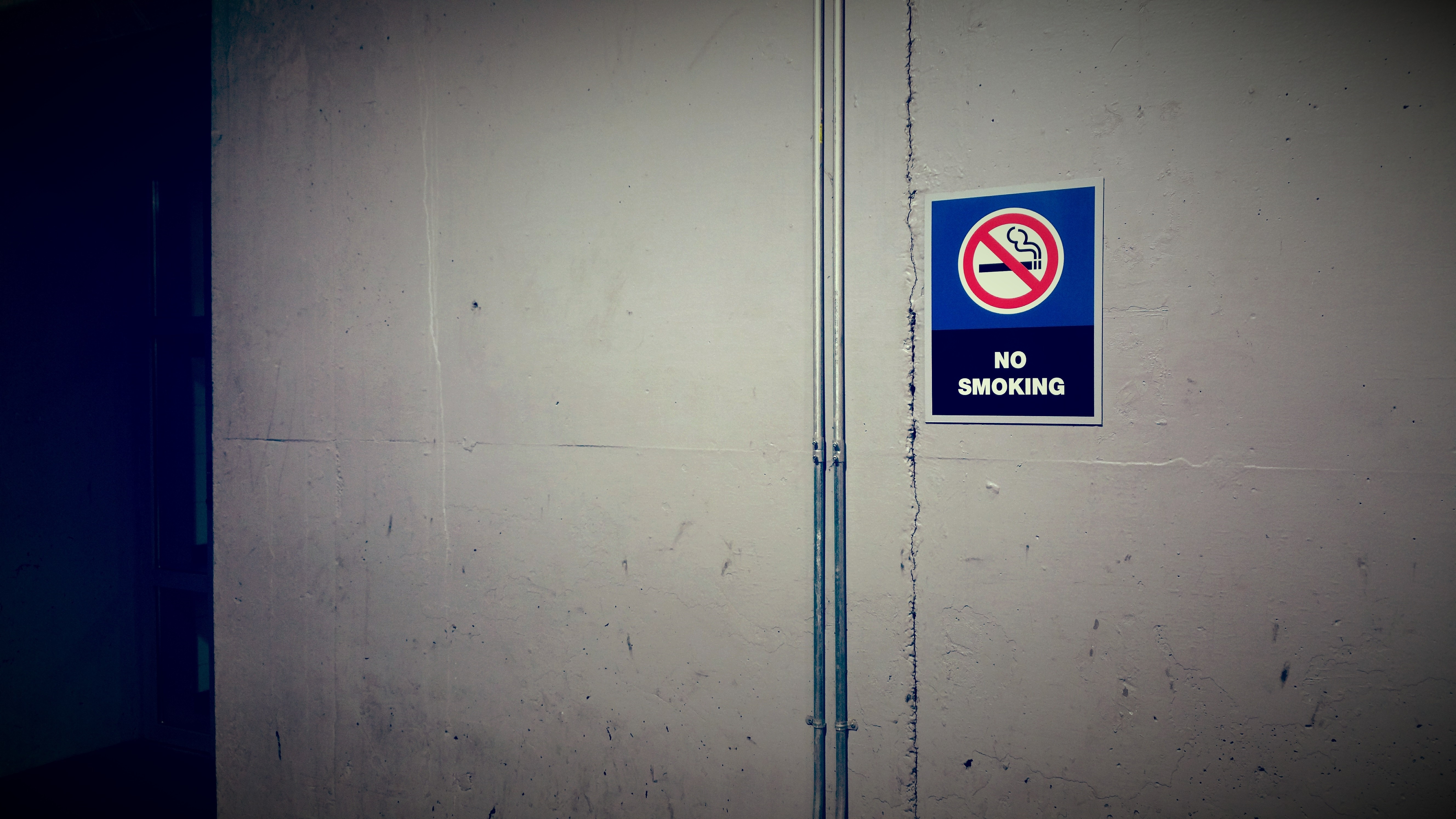 No Smoking Sign on Concrete Wall HD Wallpaper