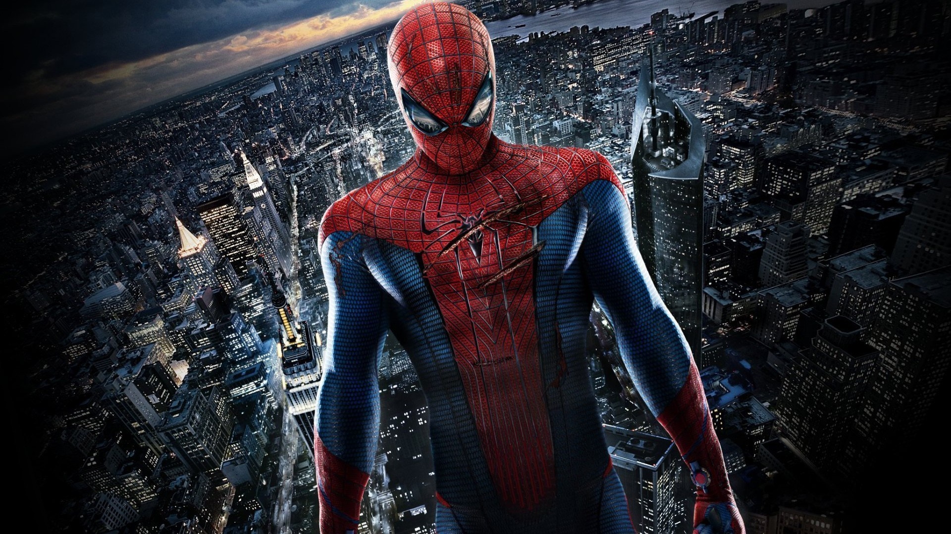 Spider-Man standing over a city at night HD Wallpaper