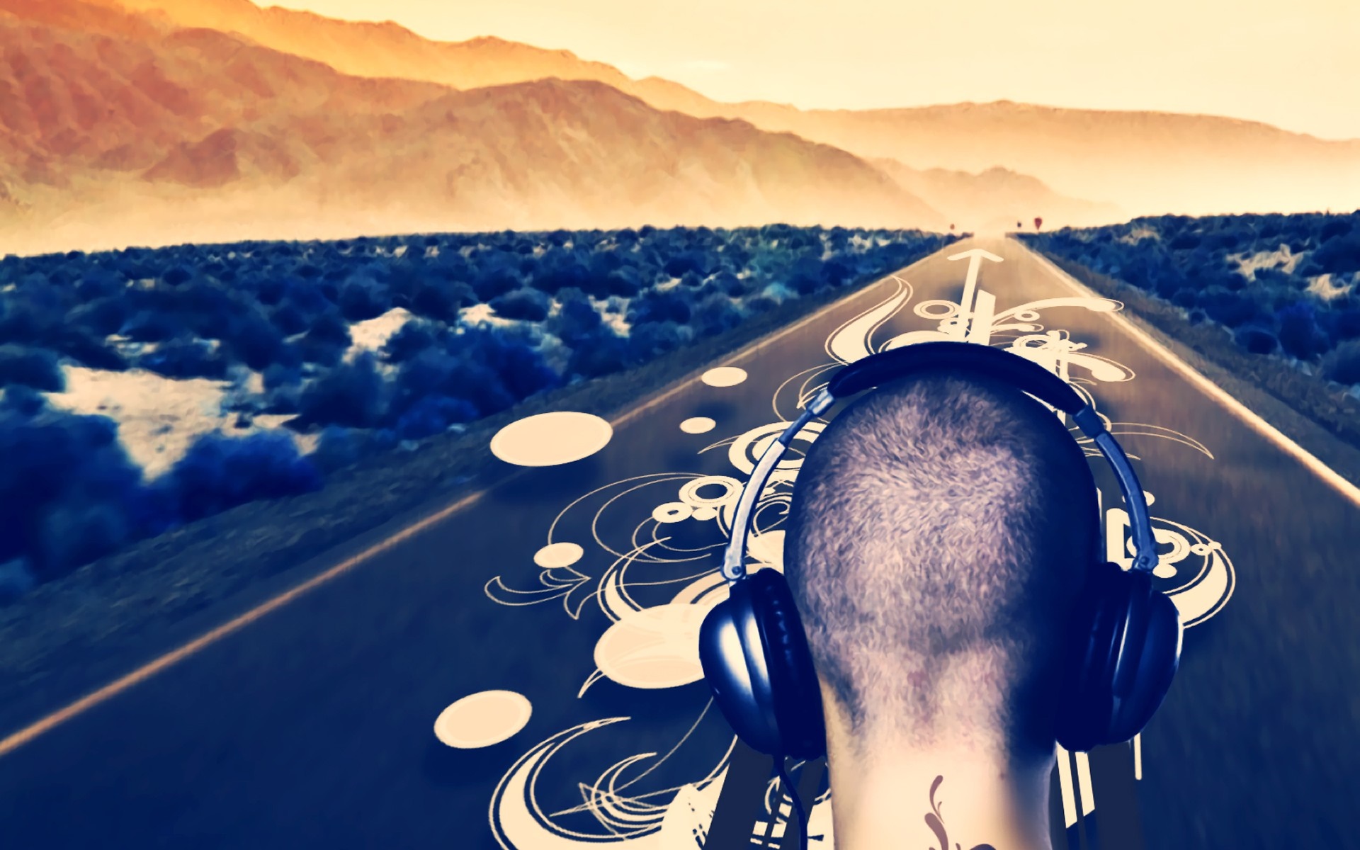 Man with headphones on a road with mountains HD Wallpaper