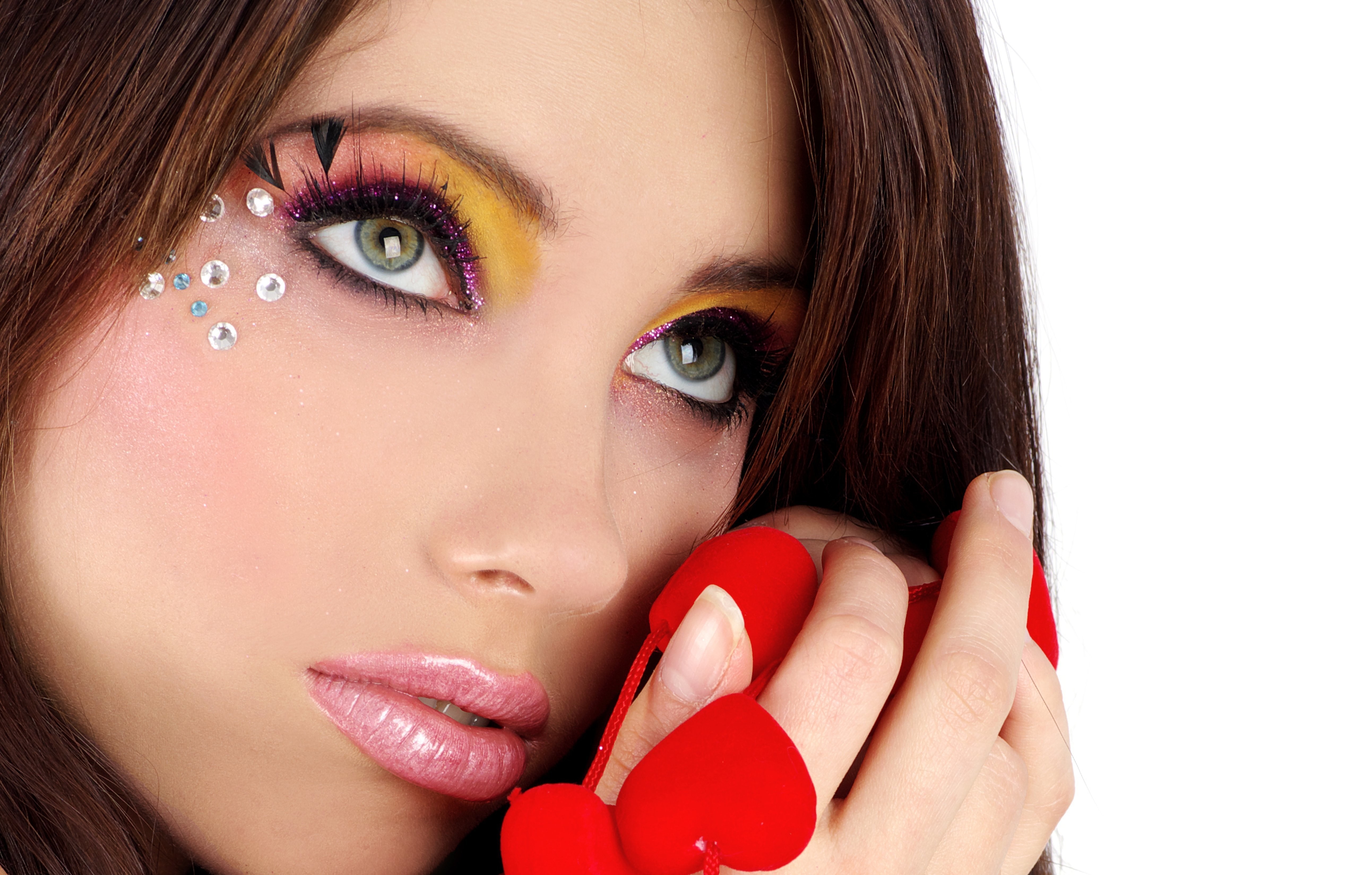 Woman with colorful eye makeup and face gems HD Wallpaper