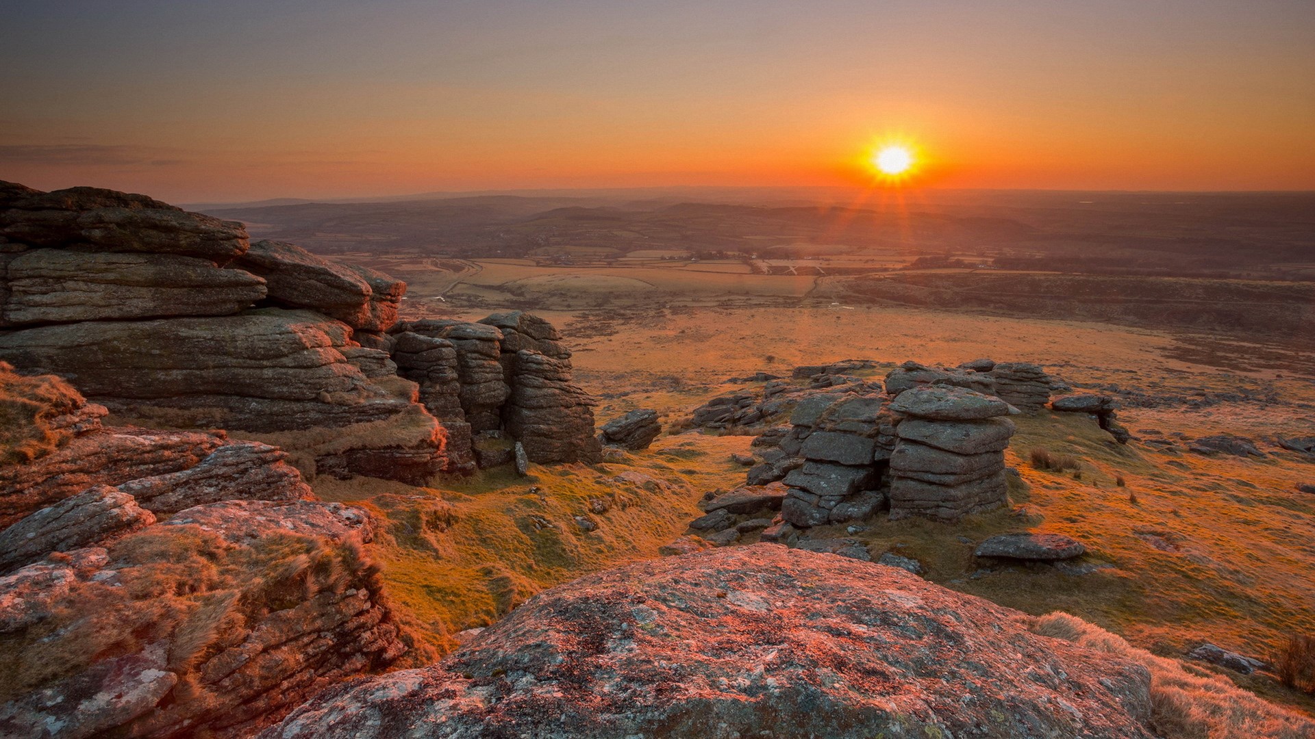 Sunset over rocky hills and fields HD Wallpaper