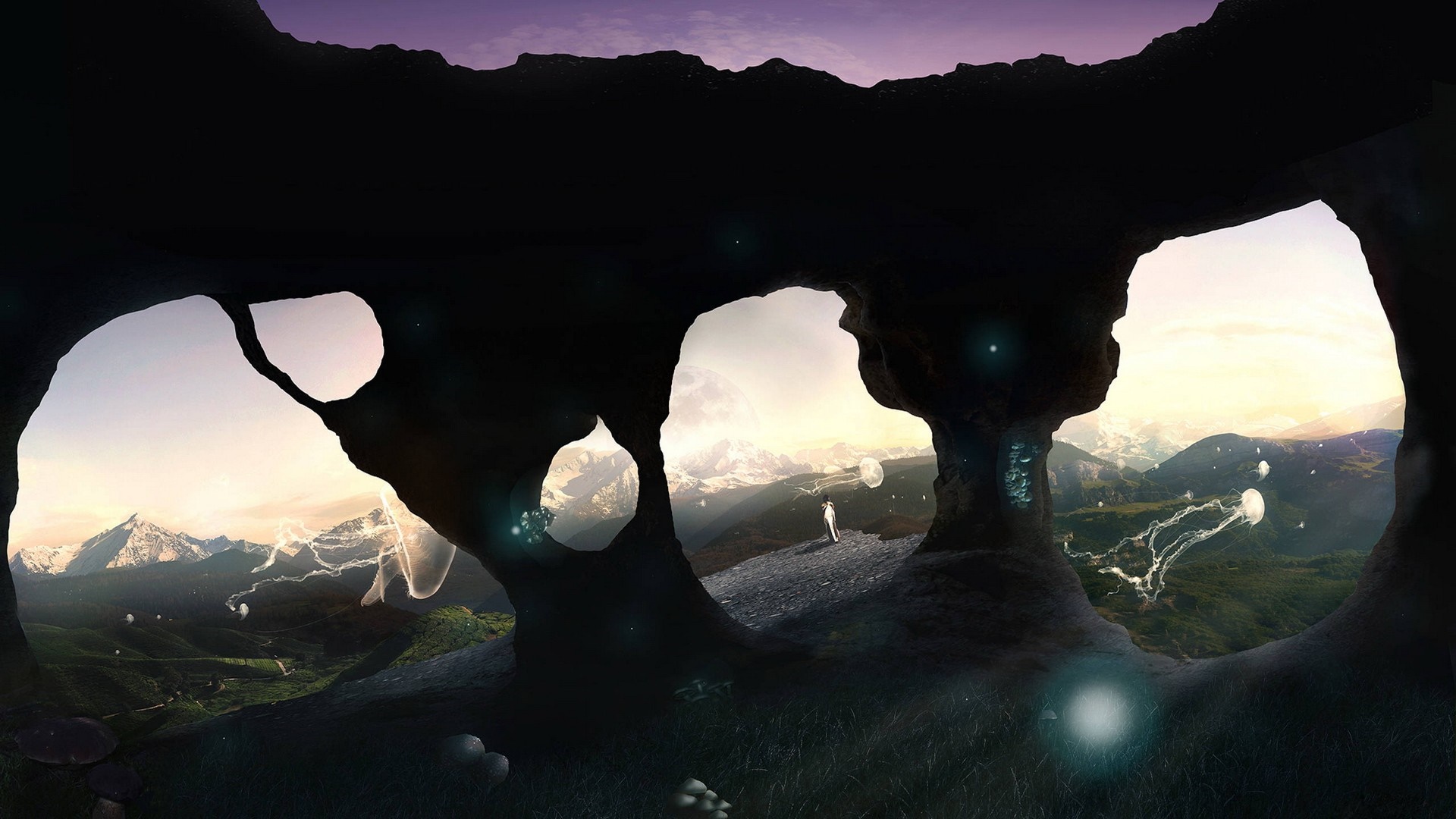 Cave opening overlooking a mountain landscape with glowing jellyfish HD Wallpaper
