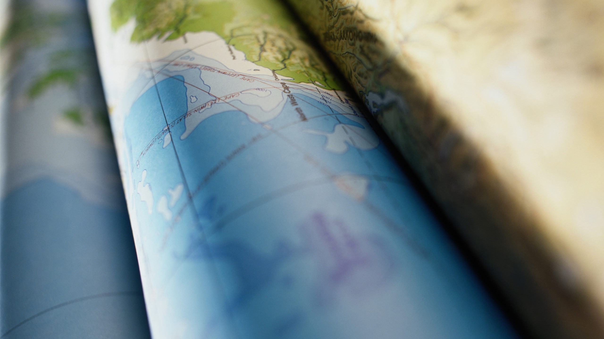 Close up of a world map with blue oceans and green land HD Wallpaper