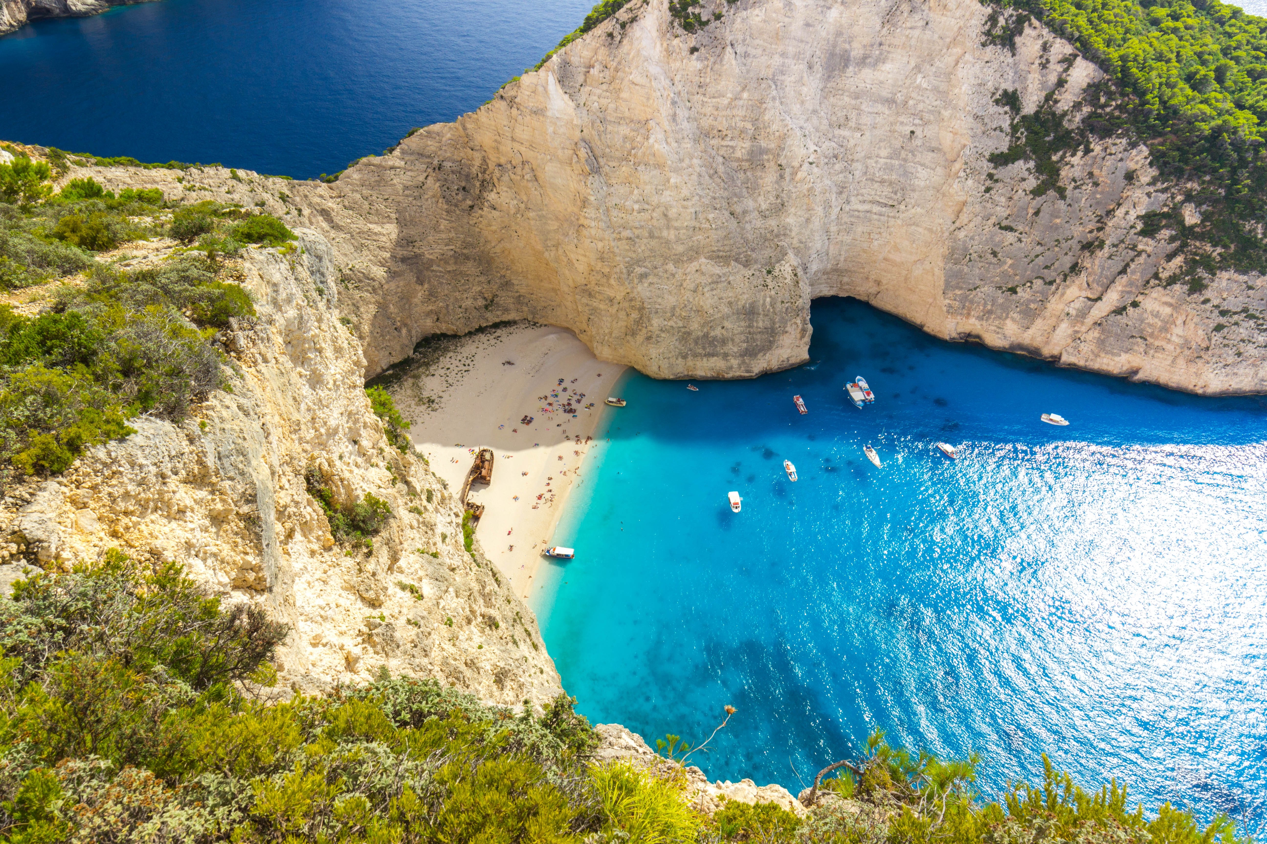 Navagio Beach Zakynthos Greece with shipwreck and boats HD Wallpaper