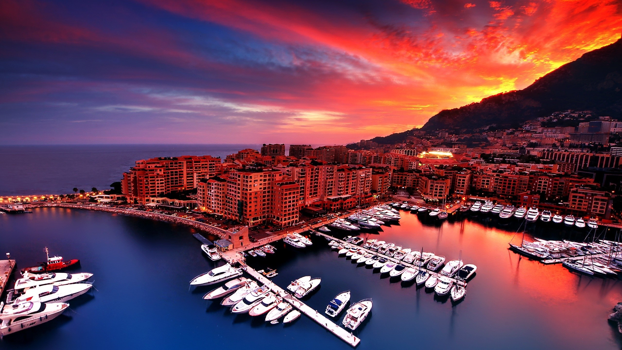 Monaco cityscape at sunset with yachts in harbor HD Wallpaper