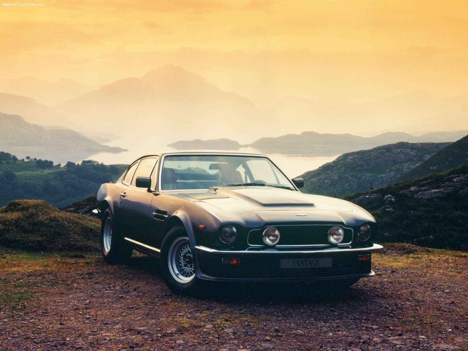 Aston Martin Vantage sports car on a rocky hill HD Wallpaper