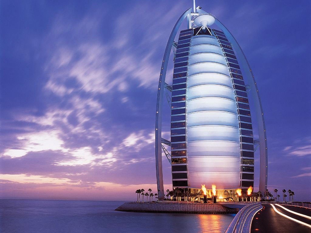Burj Al Arab hotel at night with ocean view HD Wallpaper