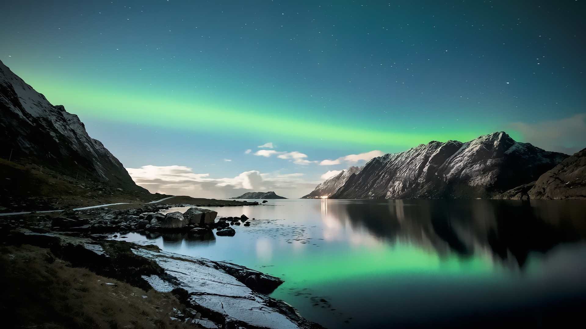 Aurora Borealis over a mountain lake at night HD Wallpaper
