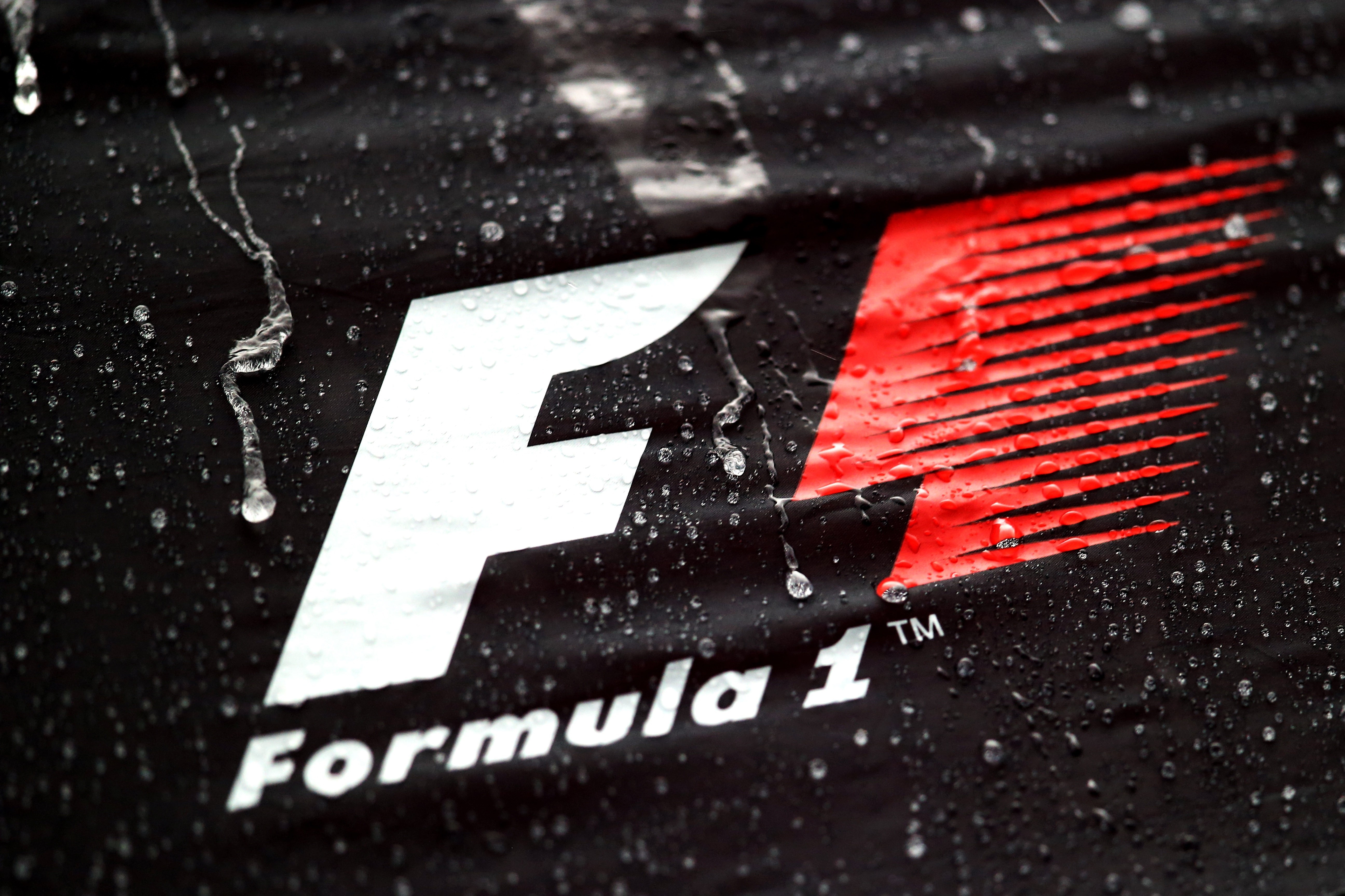 Formula 1 logo with water droplets HD Wallpaper
