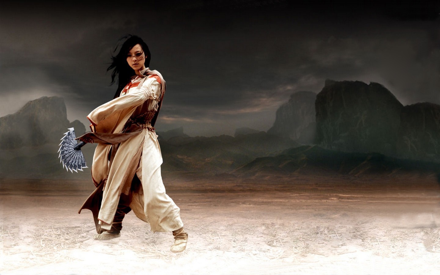 Woman with fan in a desolate landscape HD Wallpaper
