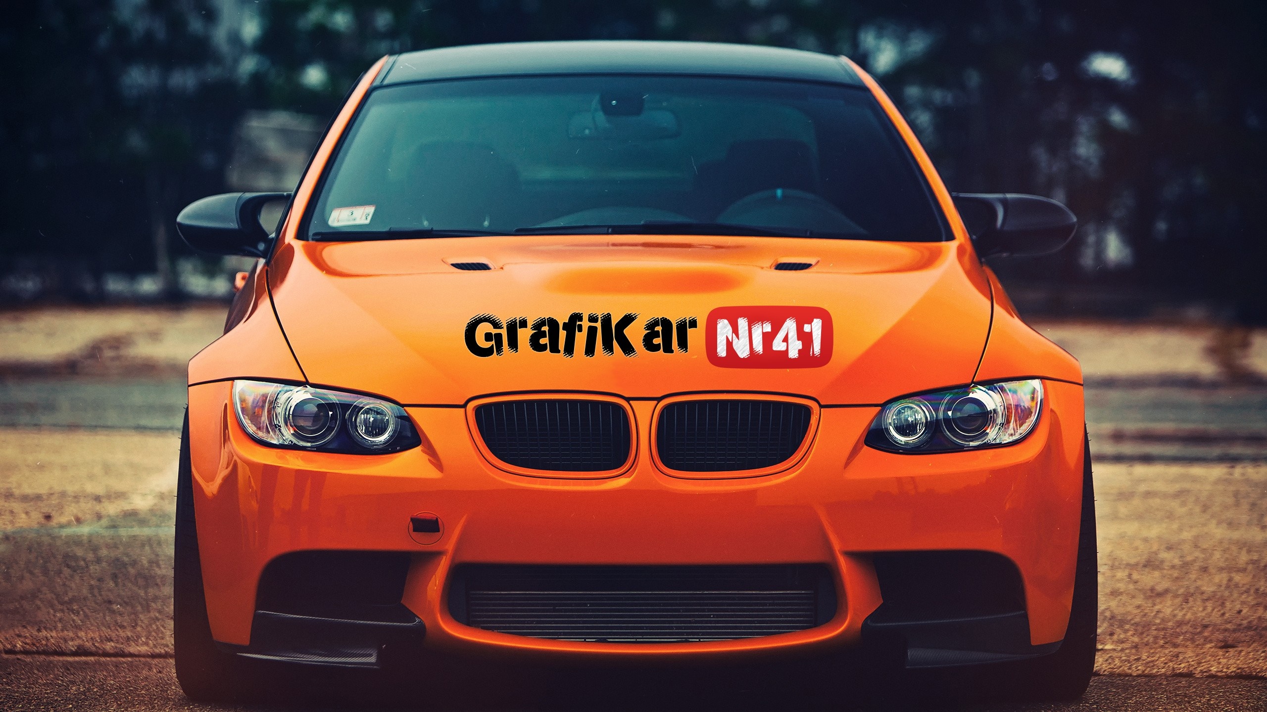 Orange BMW M3 Coupe with GrafiKar Nr41 logo HD Wallpaper