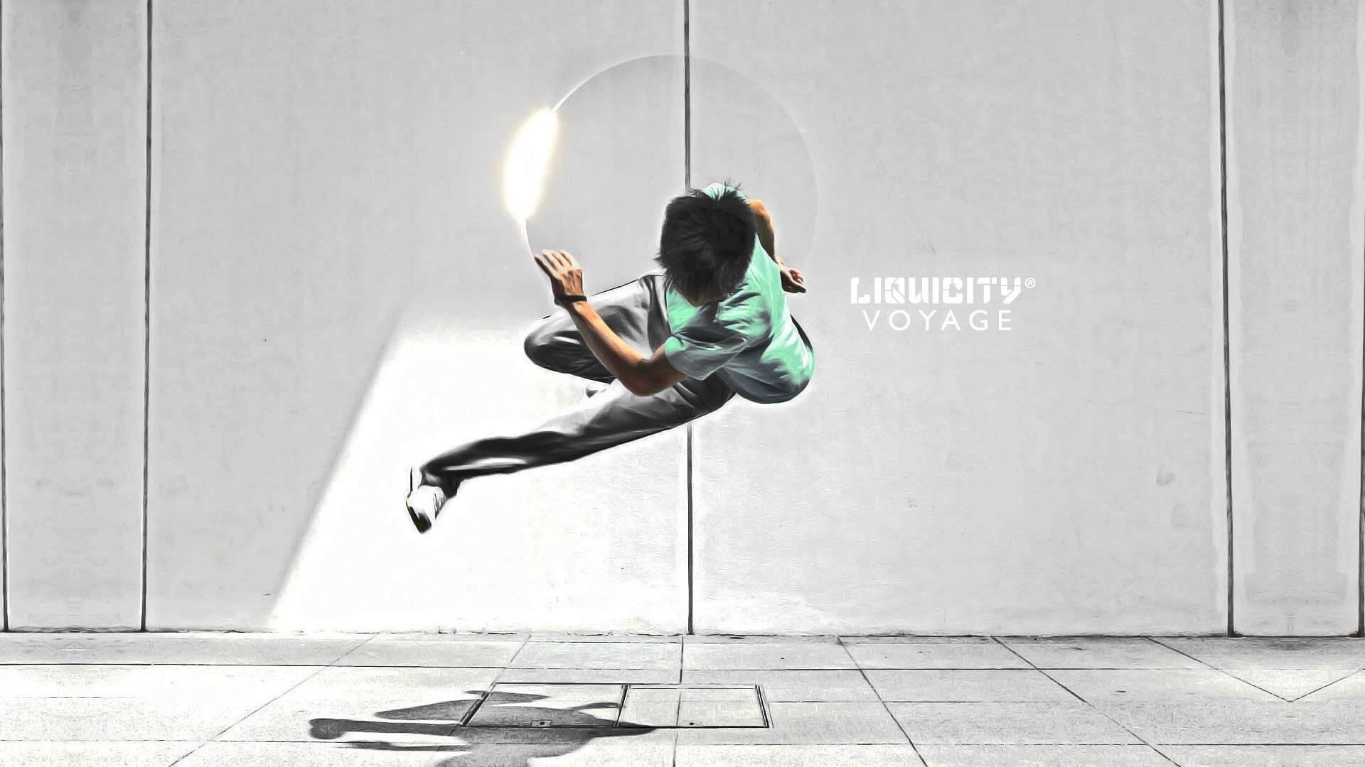 Parkour performer in mid-air with Liquicity logo HD Wallpaper